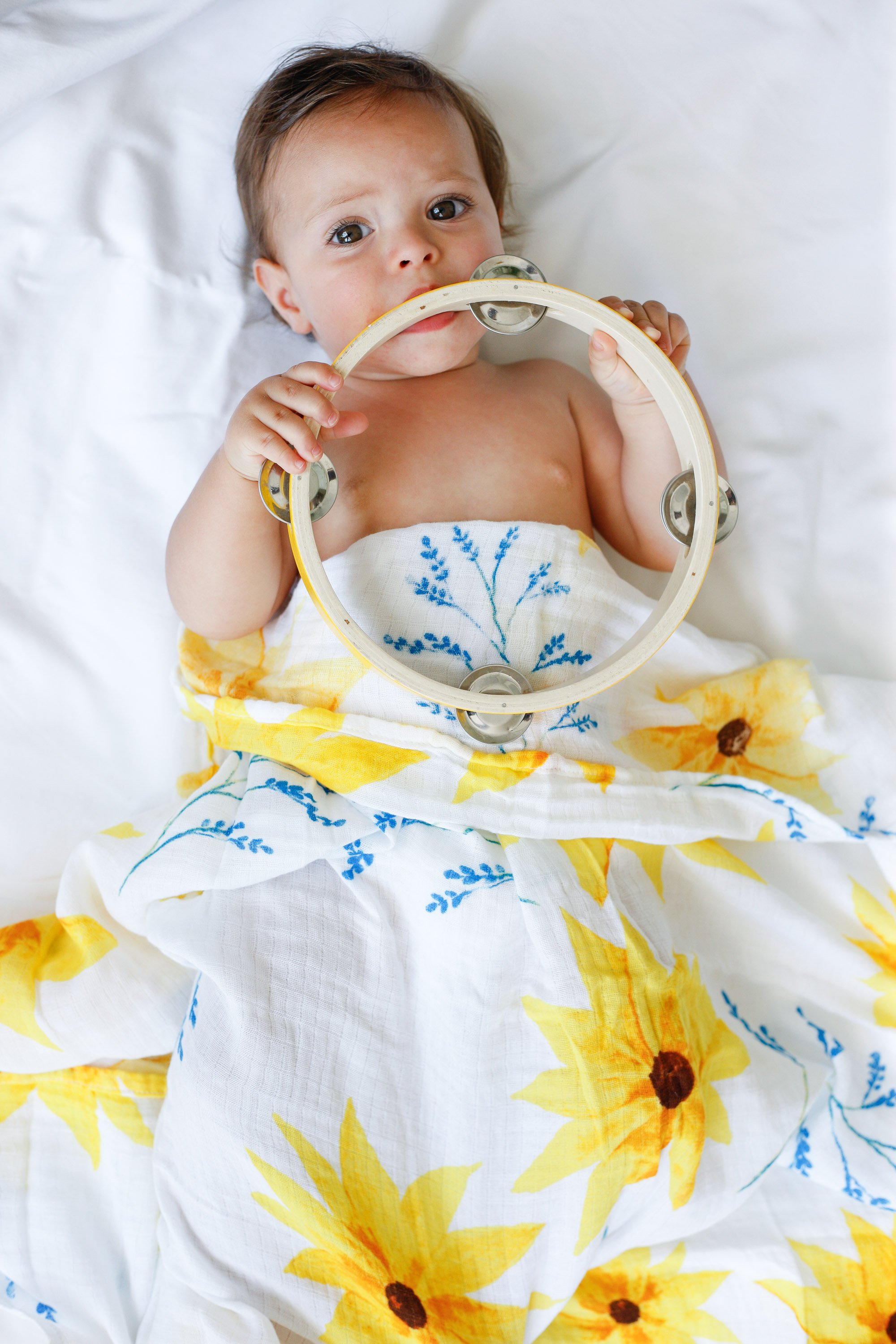 Organic Swaddle in Sunflower design, made from soft GOTS certified cotton, perfect for snuggling and versatile use.