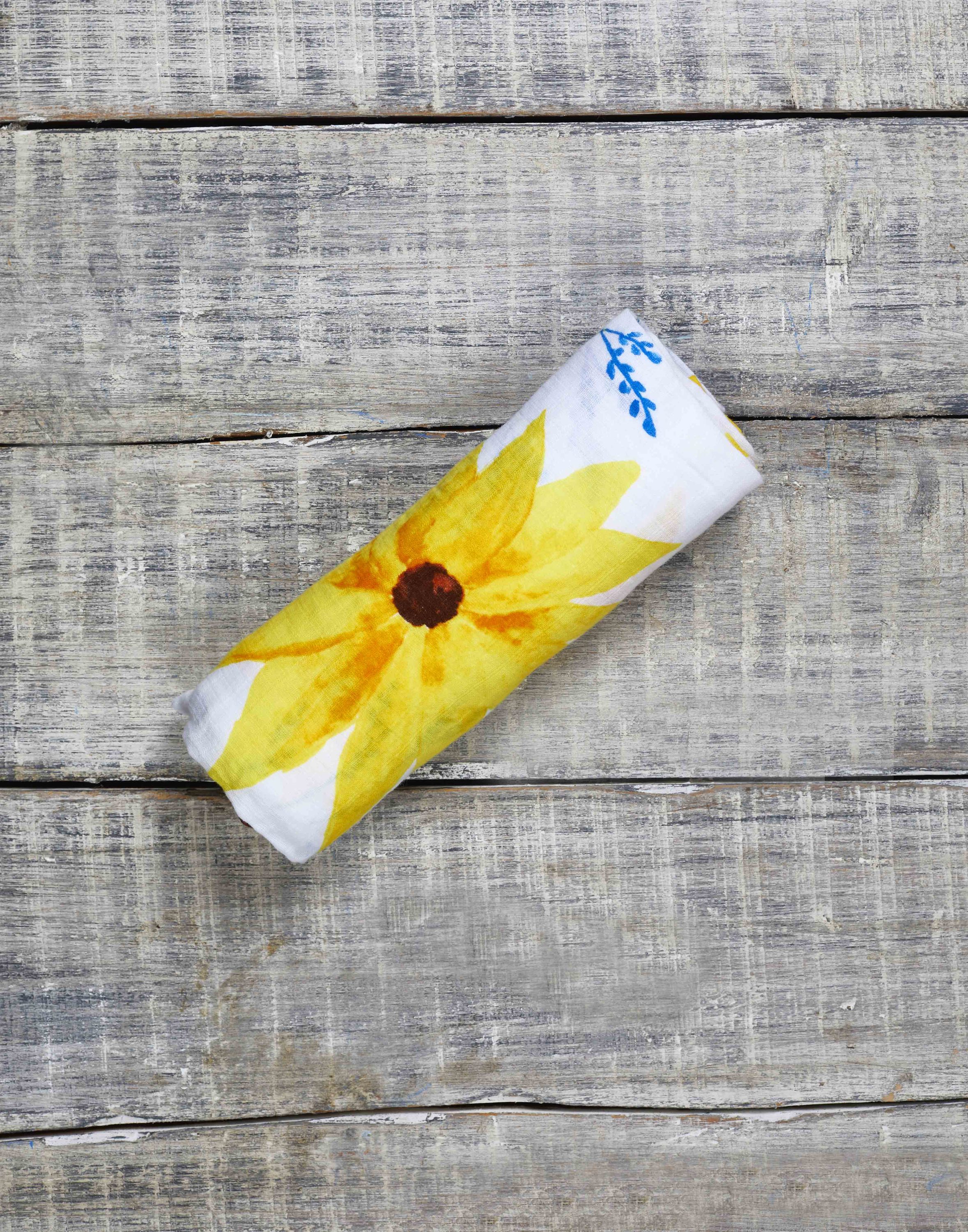 Organic Swaddle in Sunflower design, made from soft GOTS certified cotton, perfect for snuggling and versatile use.
