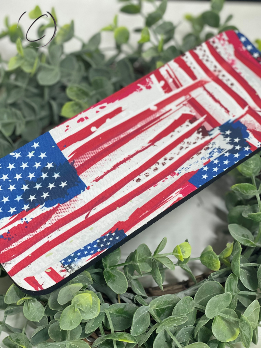 Painted American Flag Slap Wrap Can Cooler designed for 12oz cans and bottles, featuring a vibrant flag design and made of durable neoprene material.