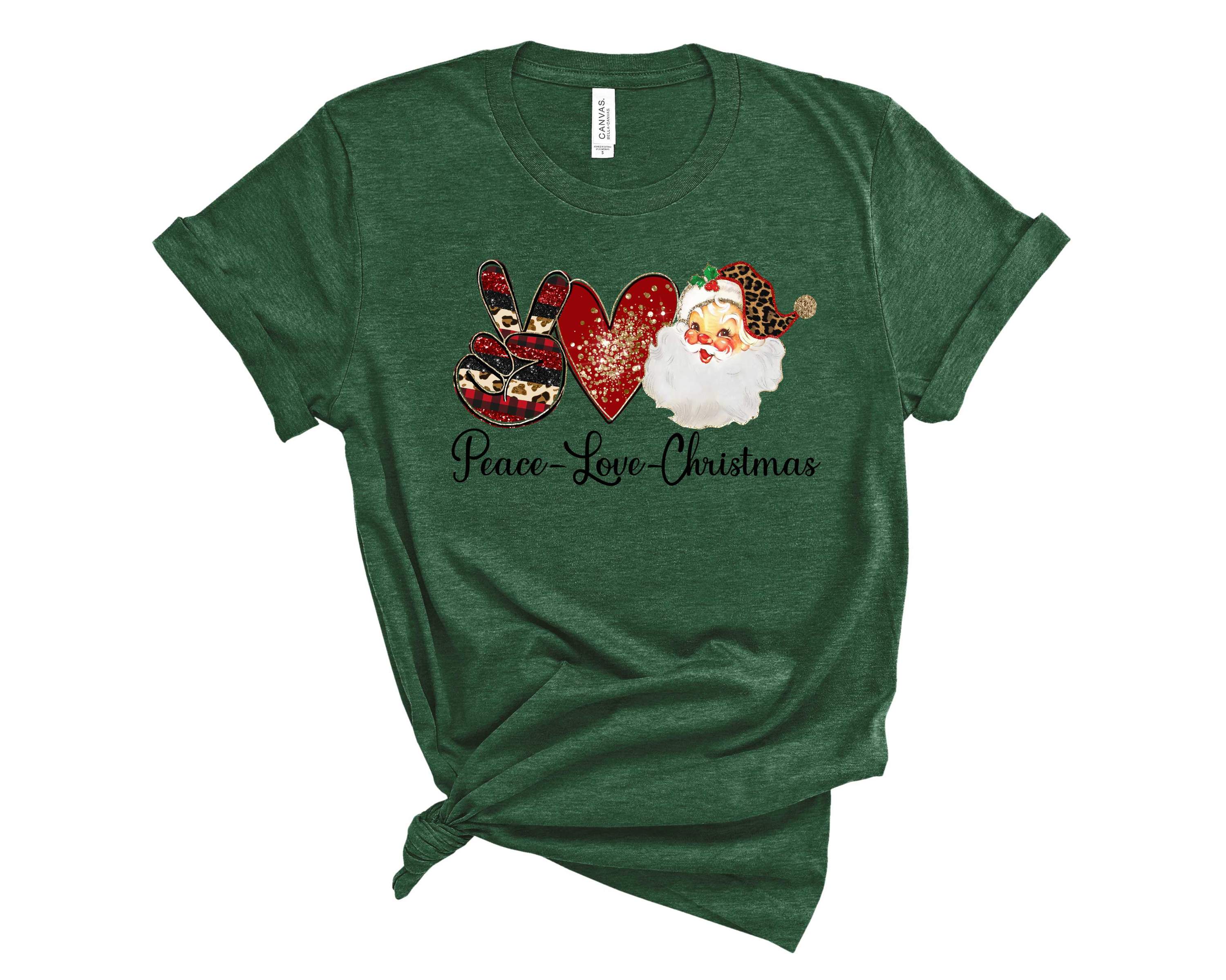 A unisex graphic tee featuring the words 'PEACE LOVE CHRISTMAS1' in festive colors, perfect for holiday celebrations.