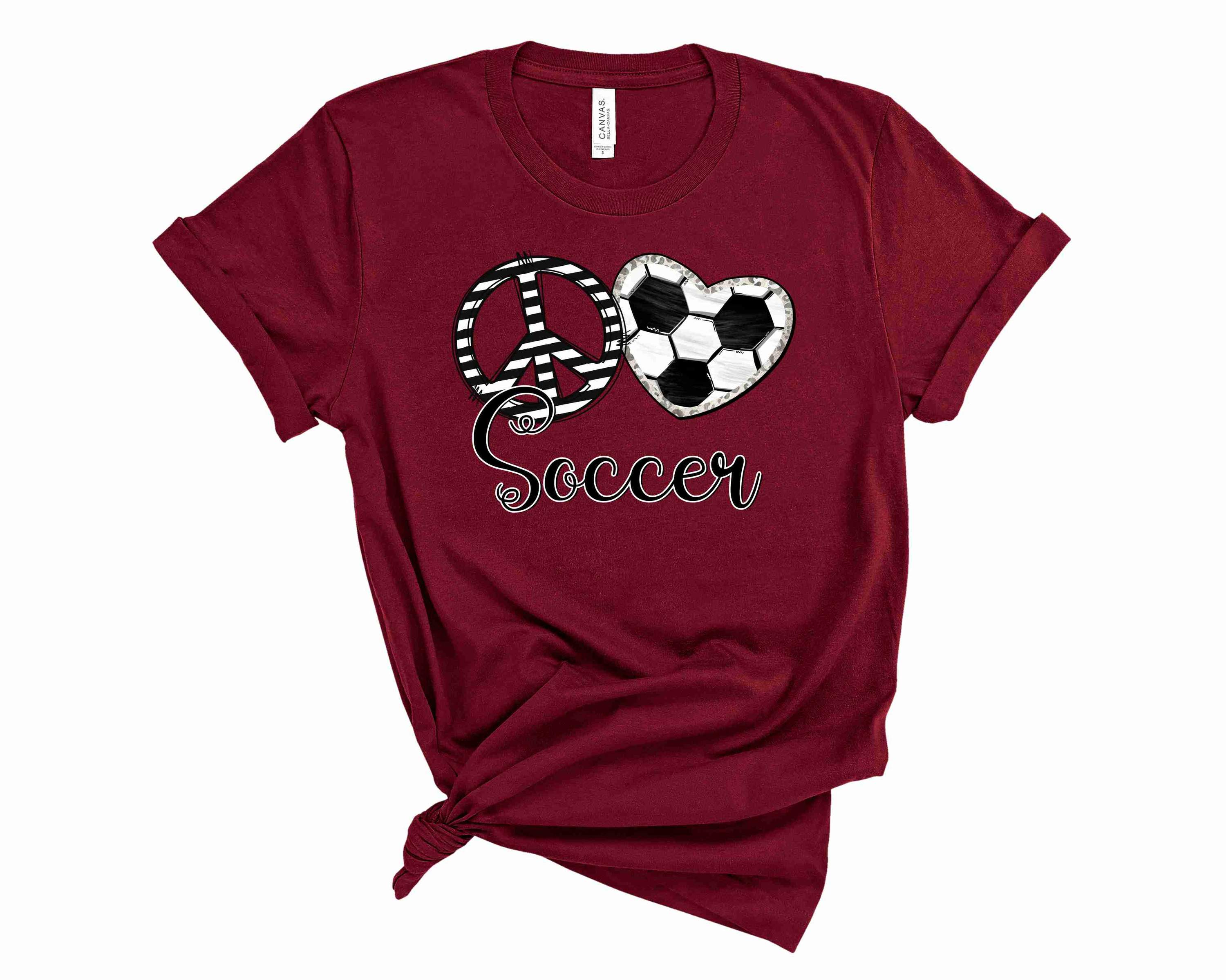 A unisex graphic tee featuring a vibrant design with the words 'Peace Love Soccer' in bold letters, perfect for soccer enthusiasts.