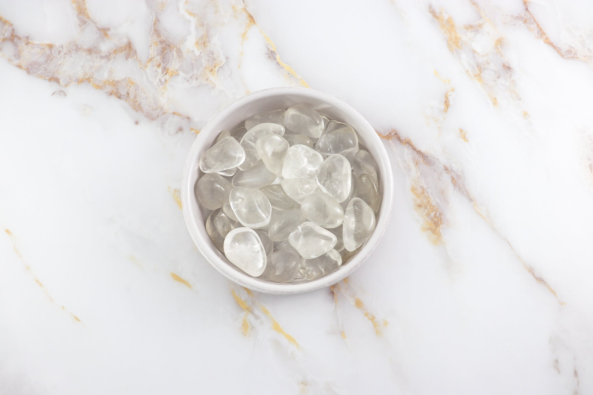 Pierre roulée en Cristal de Roche naturel, polie et transparente, provenant du Brésil, idéale pour la lithothérapie.