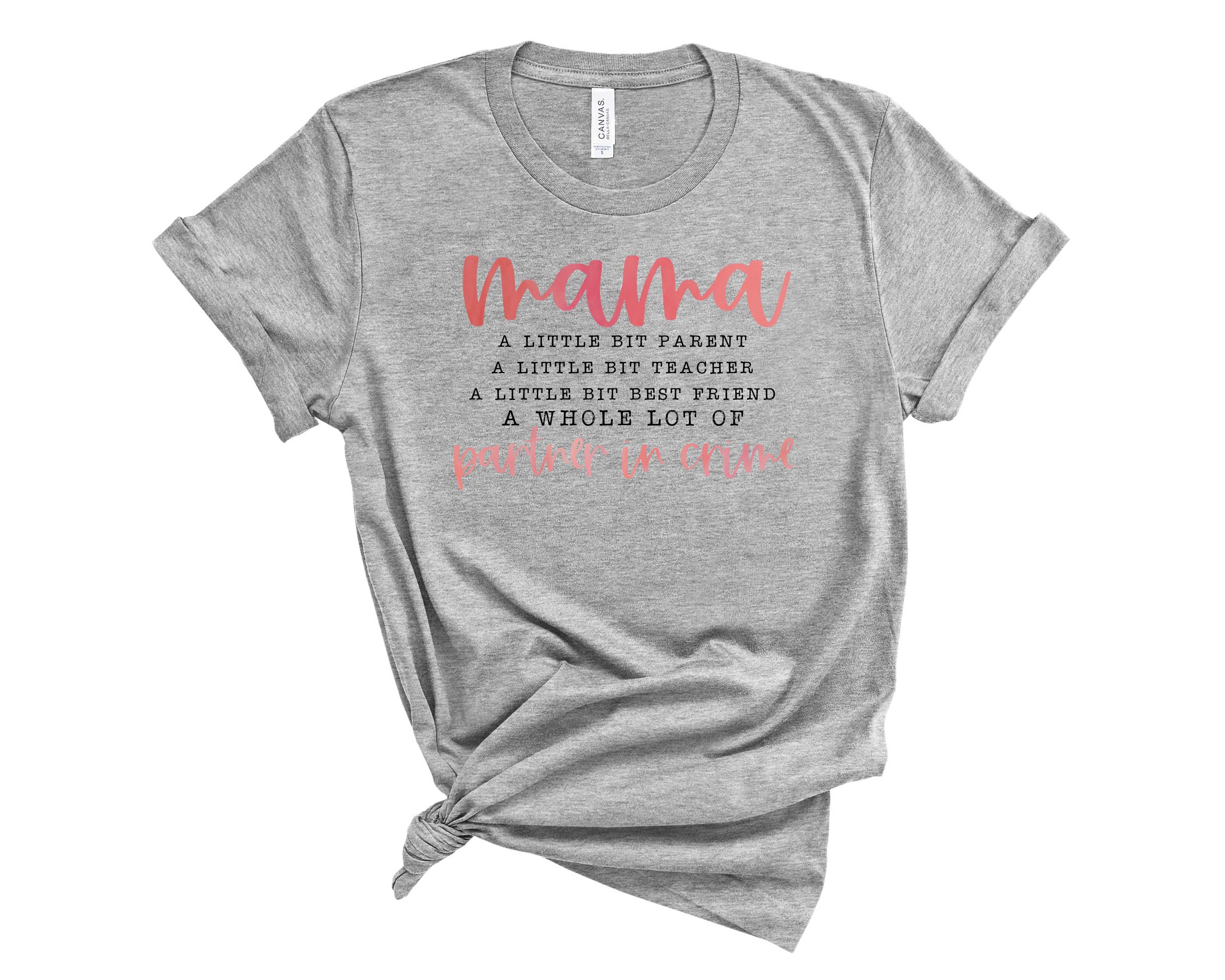 Pink MAMA Partner In Crime Graphic Tee displayed on a hanger, showcasing its trendy design and soft fabric.