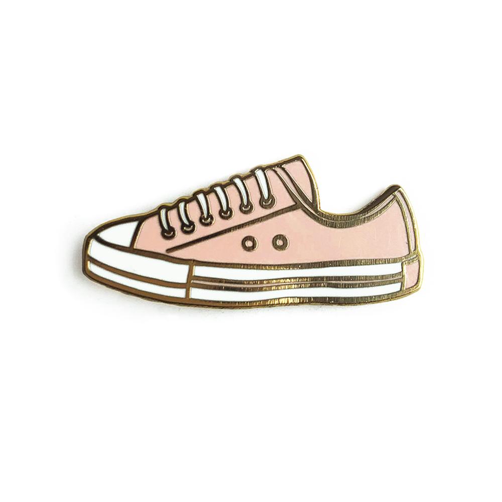 A stylish pink sneaker enamel pin with a glossy finish, perfect for fashion enthusiasts.