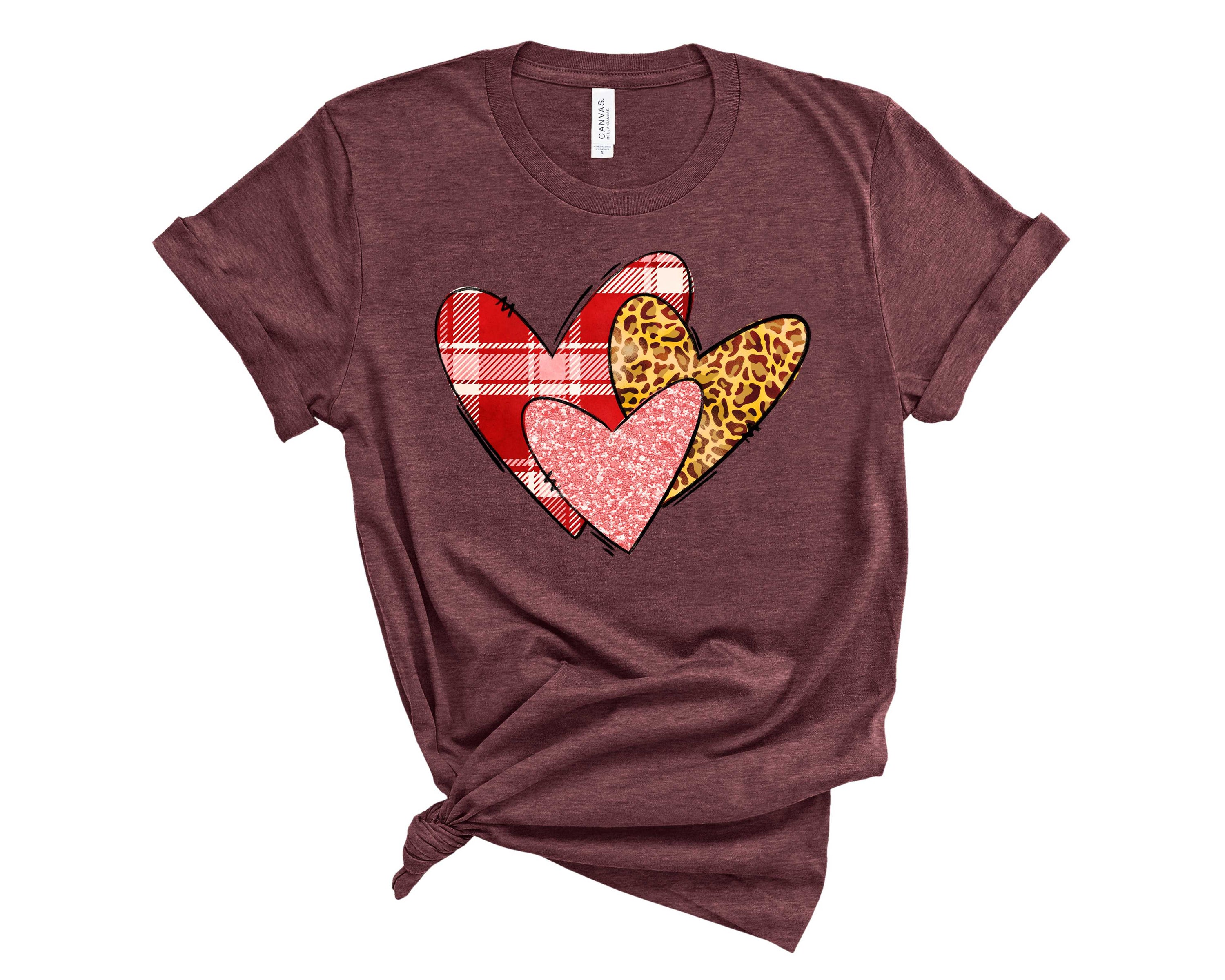 Plaid-Leopard Heart Graphic Tee featuring a stylish plaid and leopard heart design on a soft fabric, perfect for casual wear.