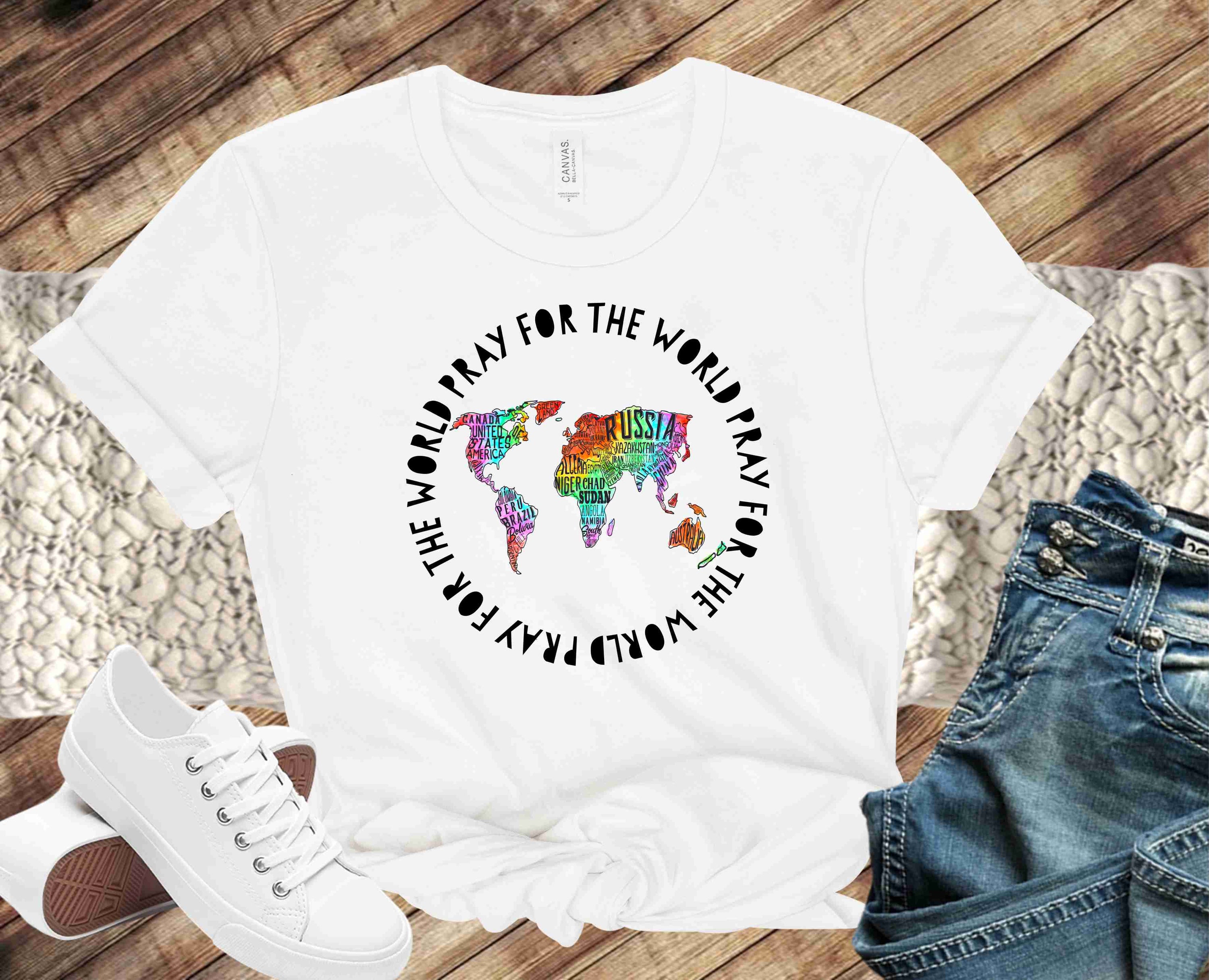 A unisex graphic tee featuring the phrase 'Pray For The World' in a stylish design, perfect for casual wear.