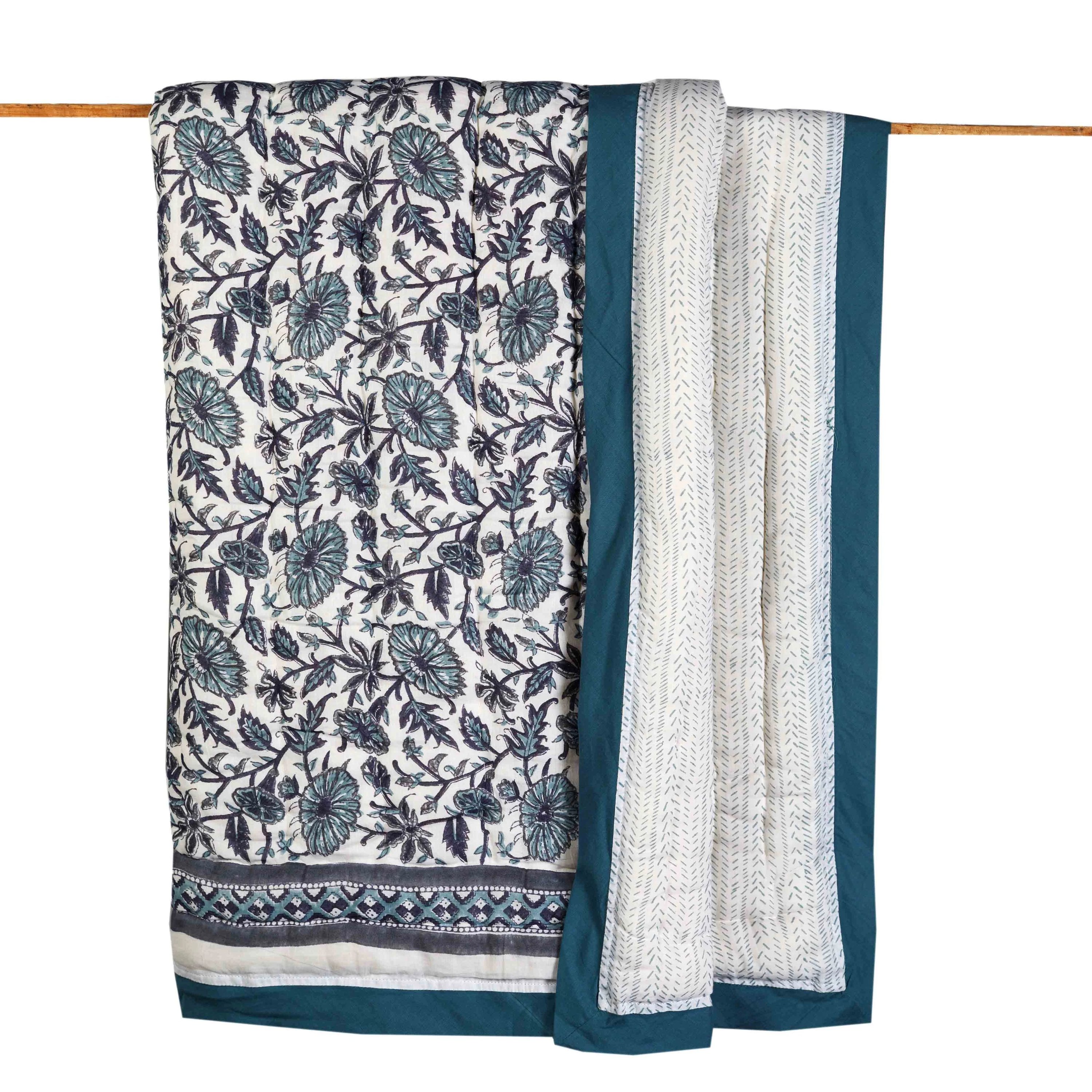 Provence Blue Cotton Quilt featuring intricate hand-stitched designs and a soft, luxurious texture, perfect for any bedroom decor.