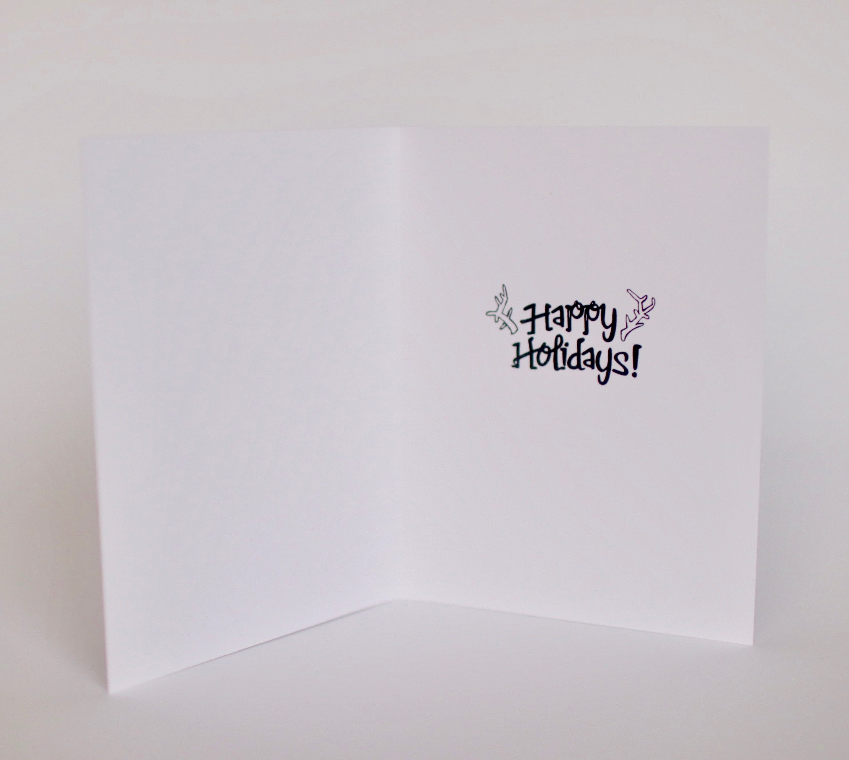 A festive Reindeer Punny Holiday Card featuring a humorous reindeer design with a cheerful message inside.
