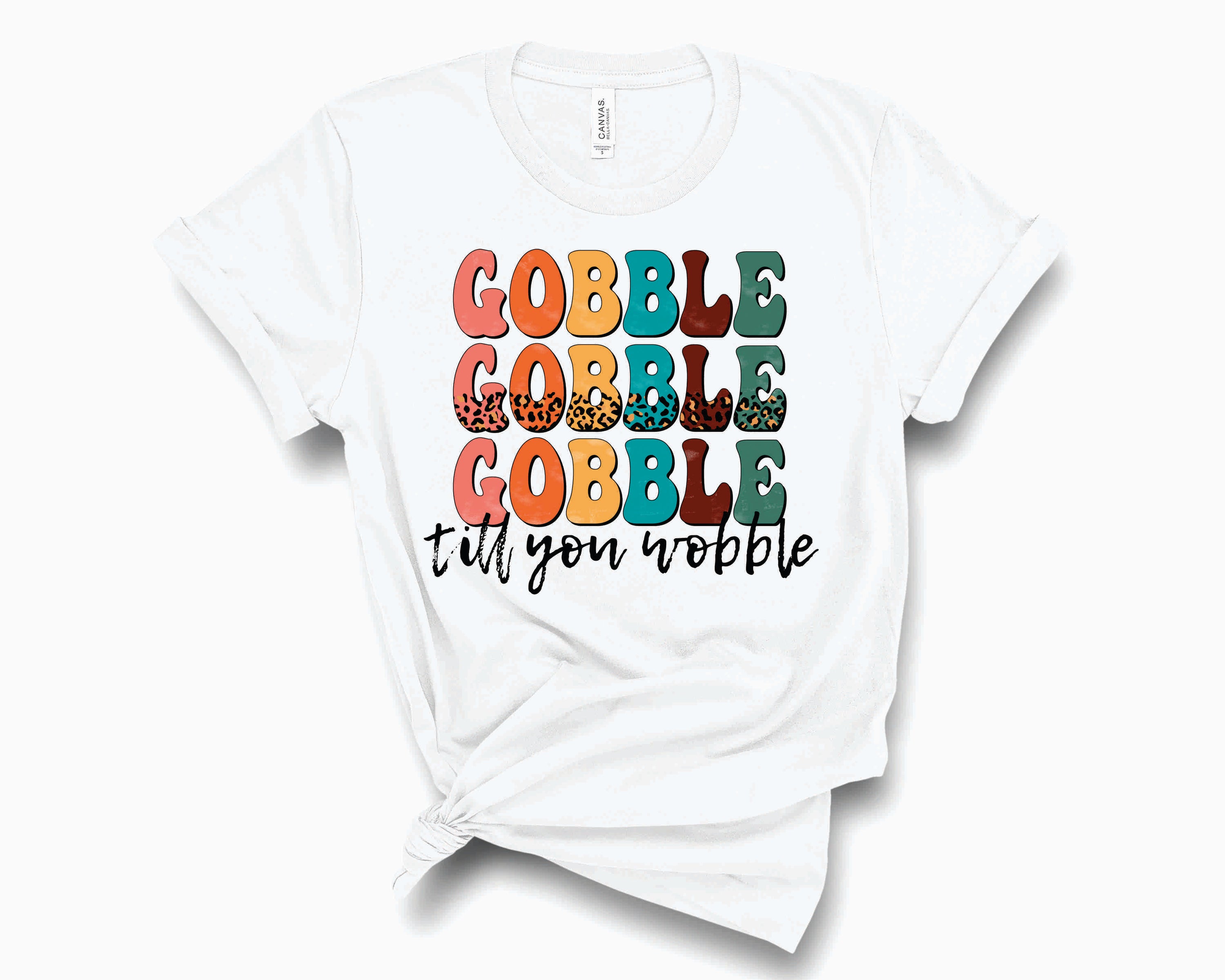 A unisex Retro Gobble Till You Wobble graphic tee featuring a colorful Thanksgiving design.