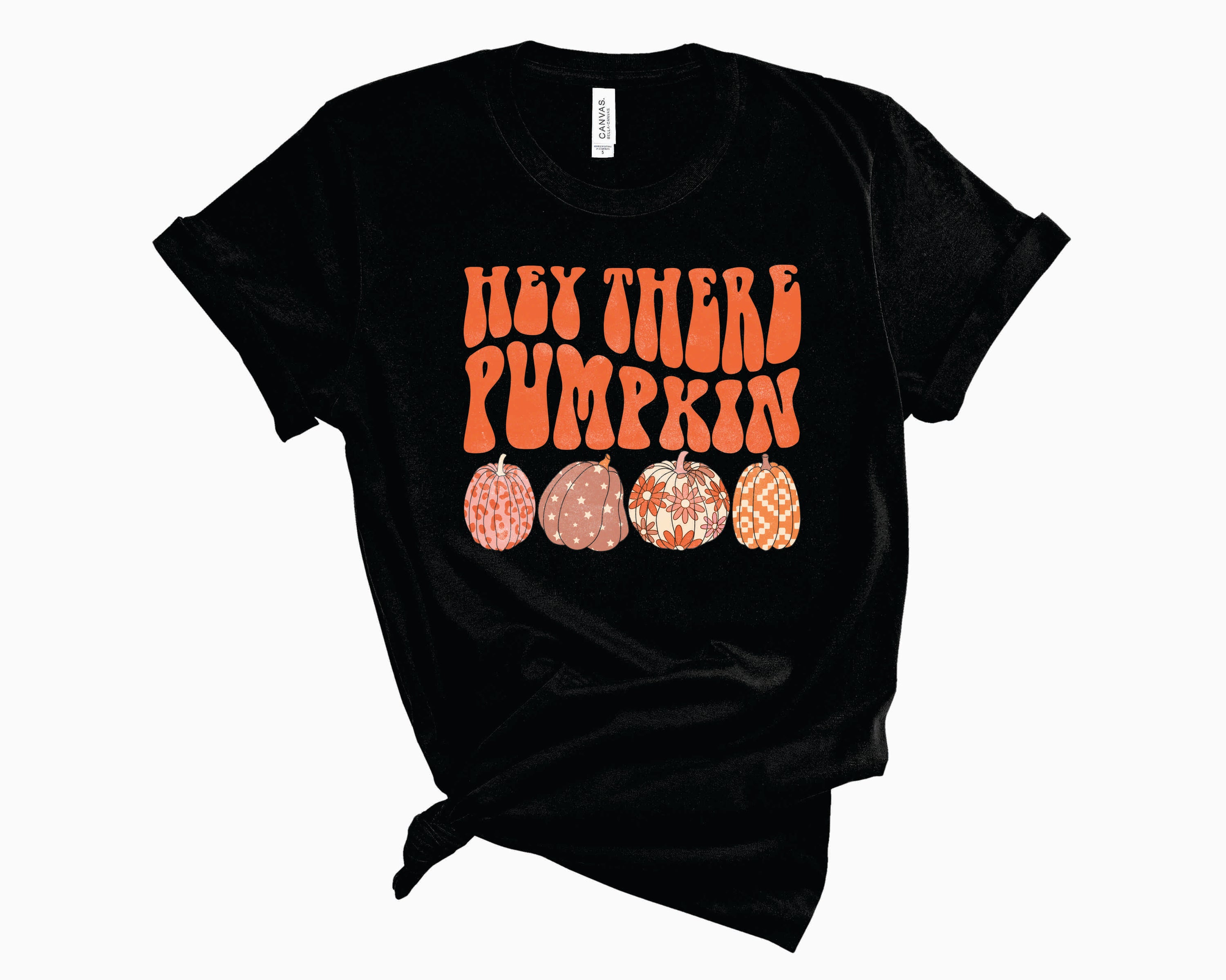 A unisex Retro Hey There Pumpkin Graphic Tee featuring a vibrant pumpkin design, perfect for autumn fashion.