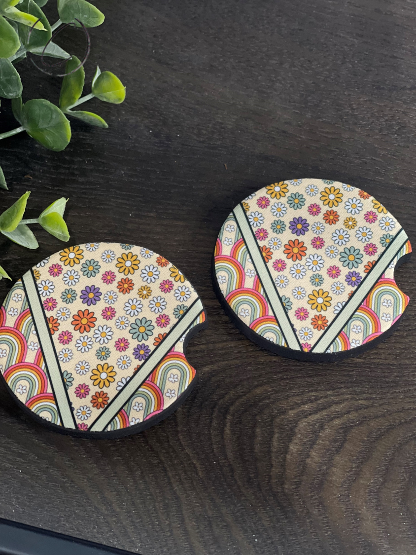 A vibrant Retro Wildflower Rainbows car coaster set featuring colorful floral designs on durable neoprene material.