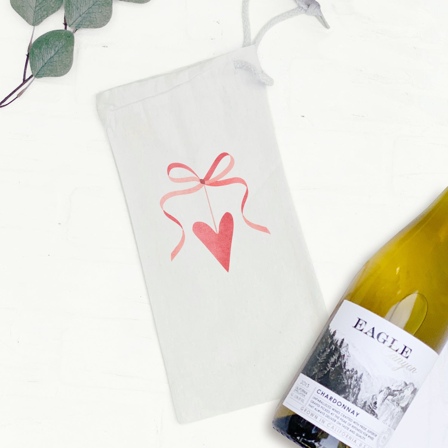 Ribbon Heart Canvas Wine Bag featuring a charming heart design, made from durable cotton canvas, perfect for gifting wine.