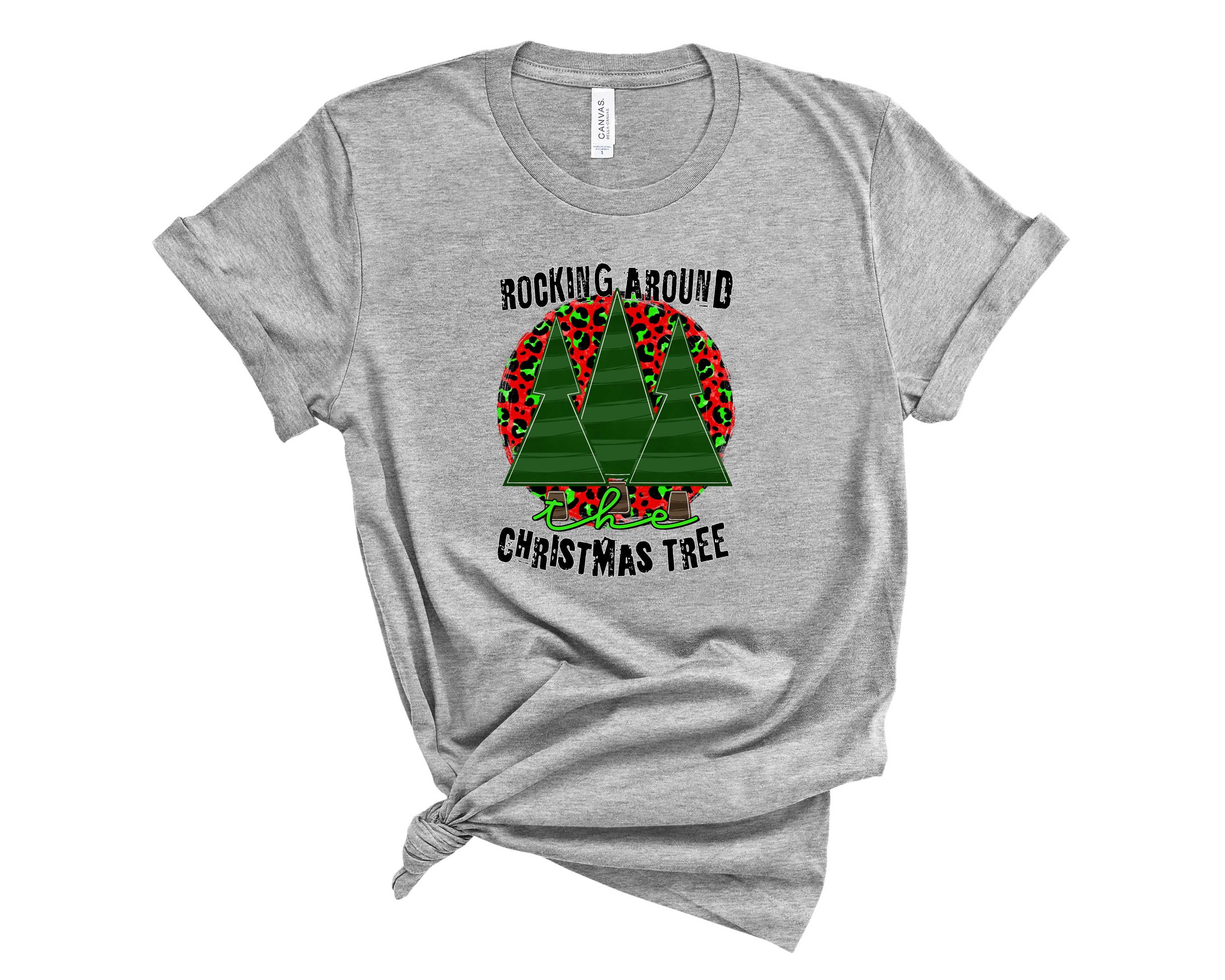 A unisex graphic tee featuring a festive 'Rocking Around the Tree' design, perfect for holiday celebrations.