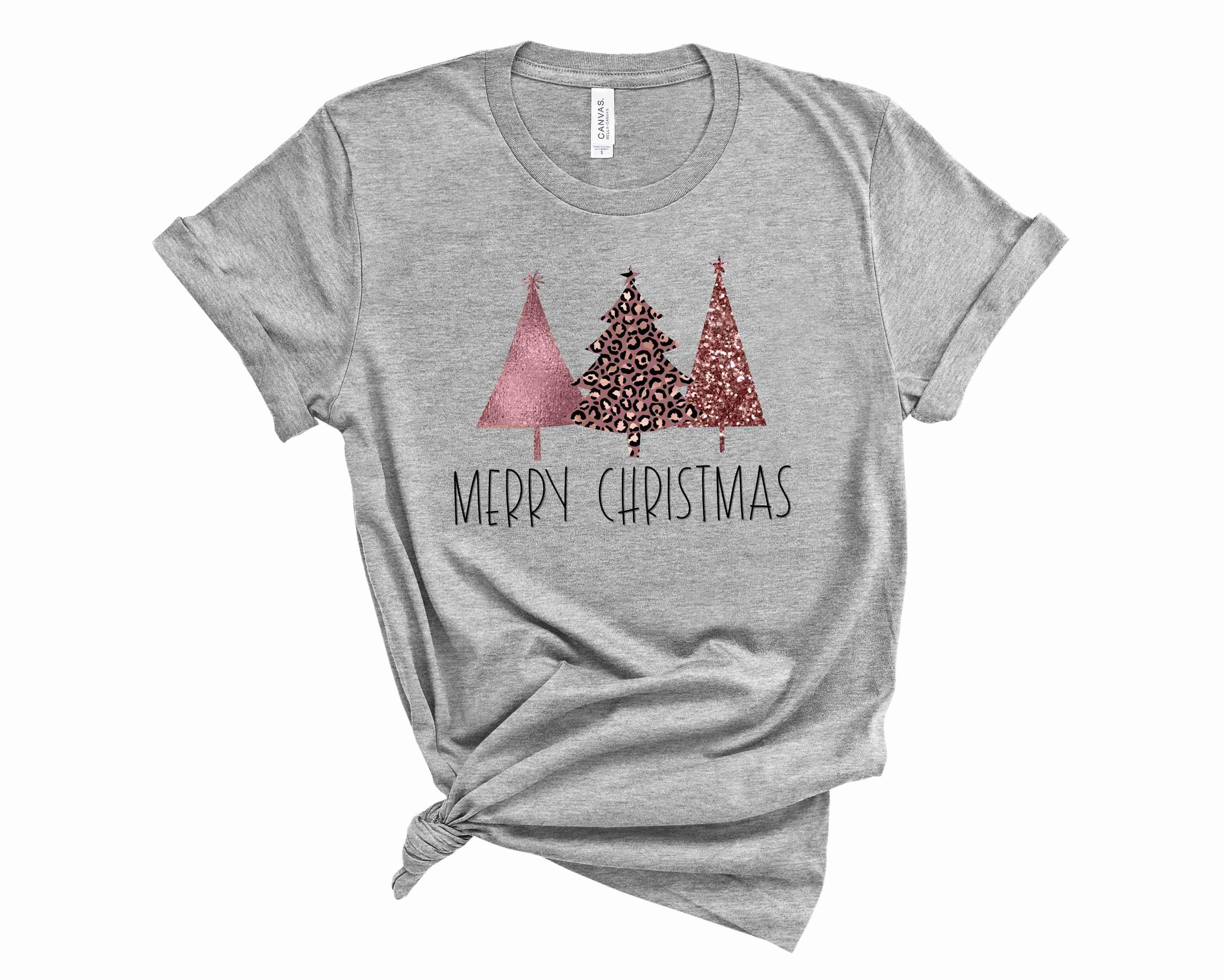 Rose Gold Merry Christmas Graphic Tee featuring a stylish design suitable for all genders.