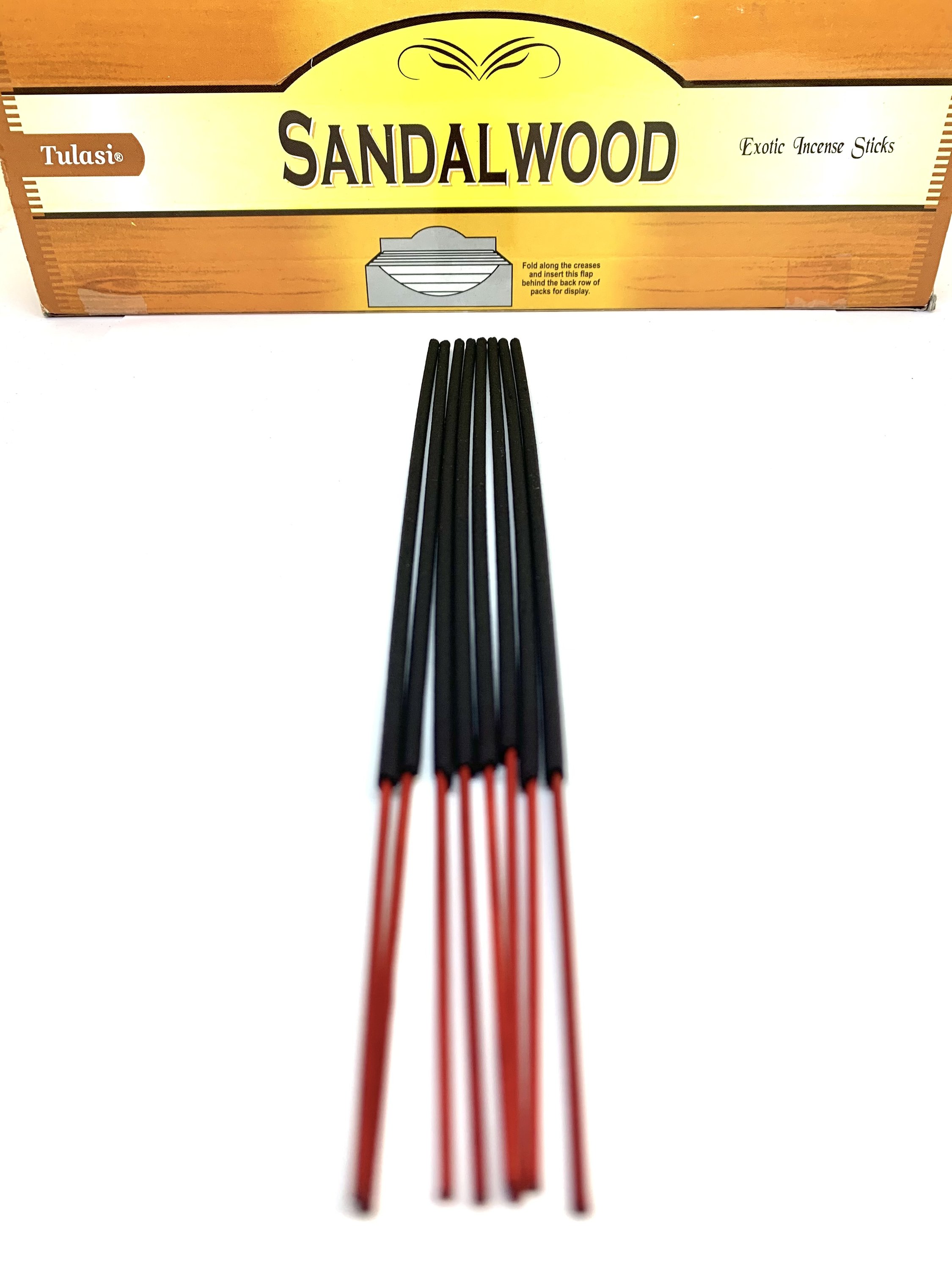 A pack of 8 sandalwood incense sticks with a rich, woody aroma, perfect for meditation and relaxation.