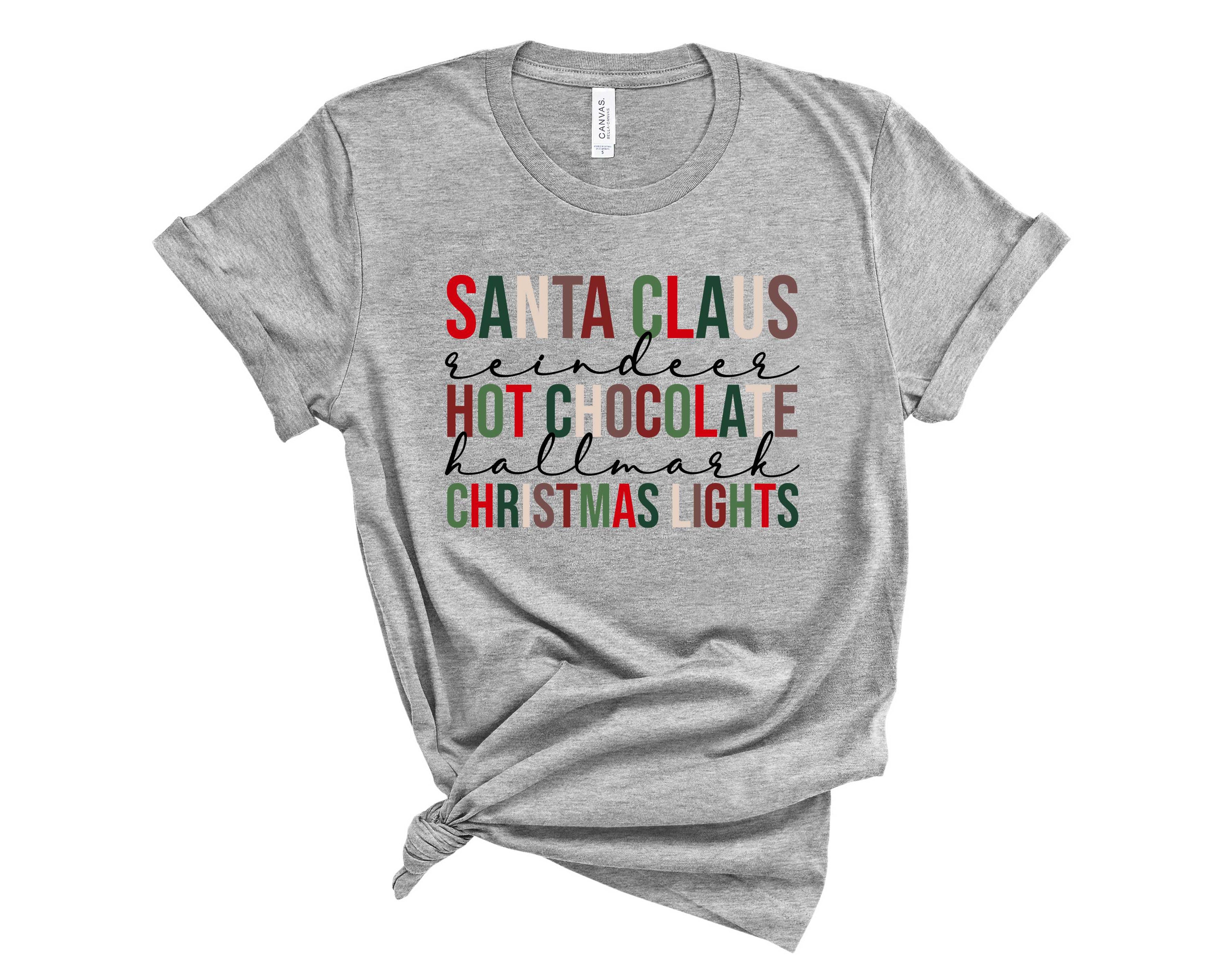 A festive unisex t-shirt featuring a colorful Santa Clause graphic with hot chocolate, perfect for Christmas celebrations.
