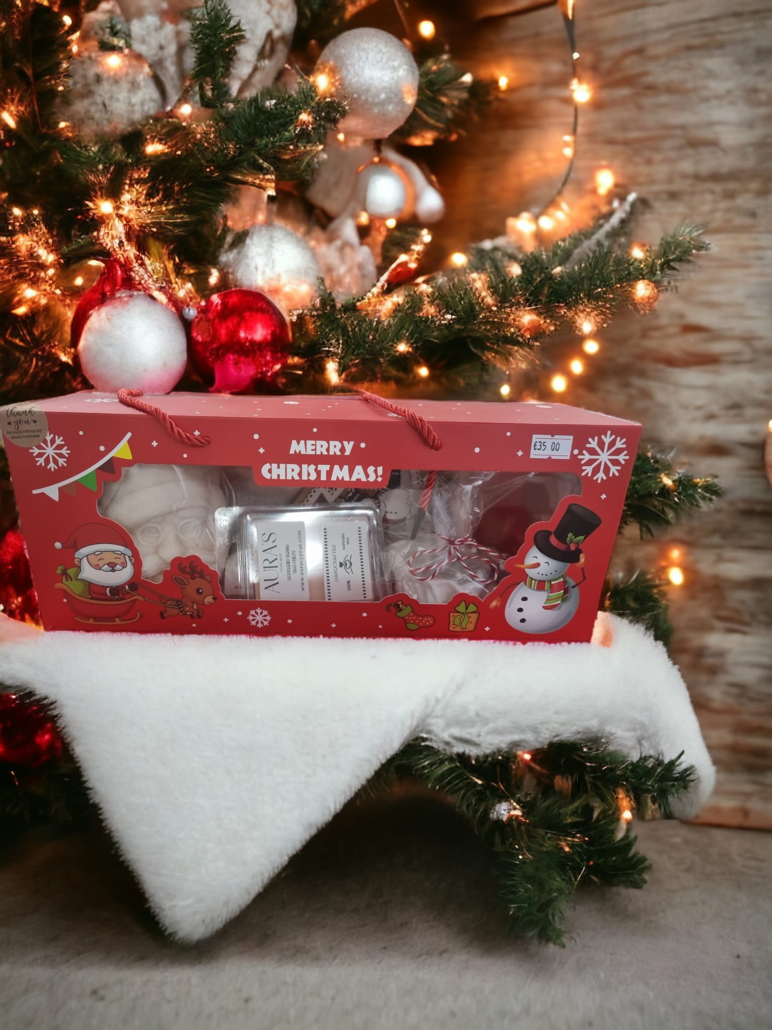 Santa's Treasure Christmas Large Box filled with scented candles, bath salts, and decorative items for the holiday season.