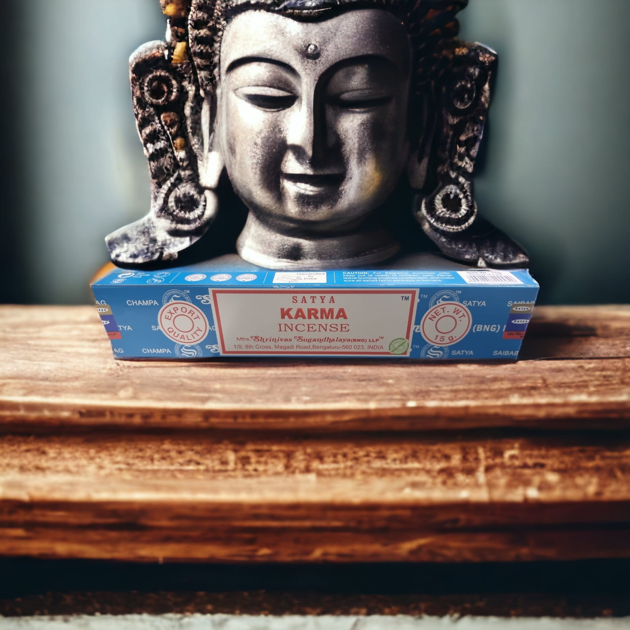A pack of Satya Karma Incense Sticks with vibrant packaging, showcasing the hand-rolled sticks inside.