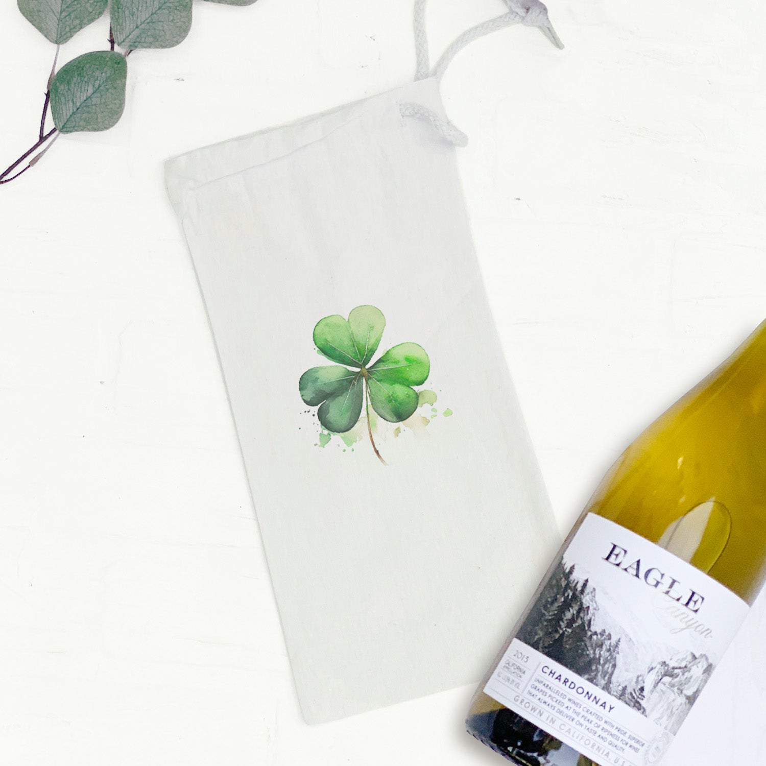 Shamrock Canvas Wine Bag featuring a matching drawstring closure, designed to hold a standard 750mL wine bottle.