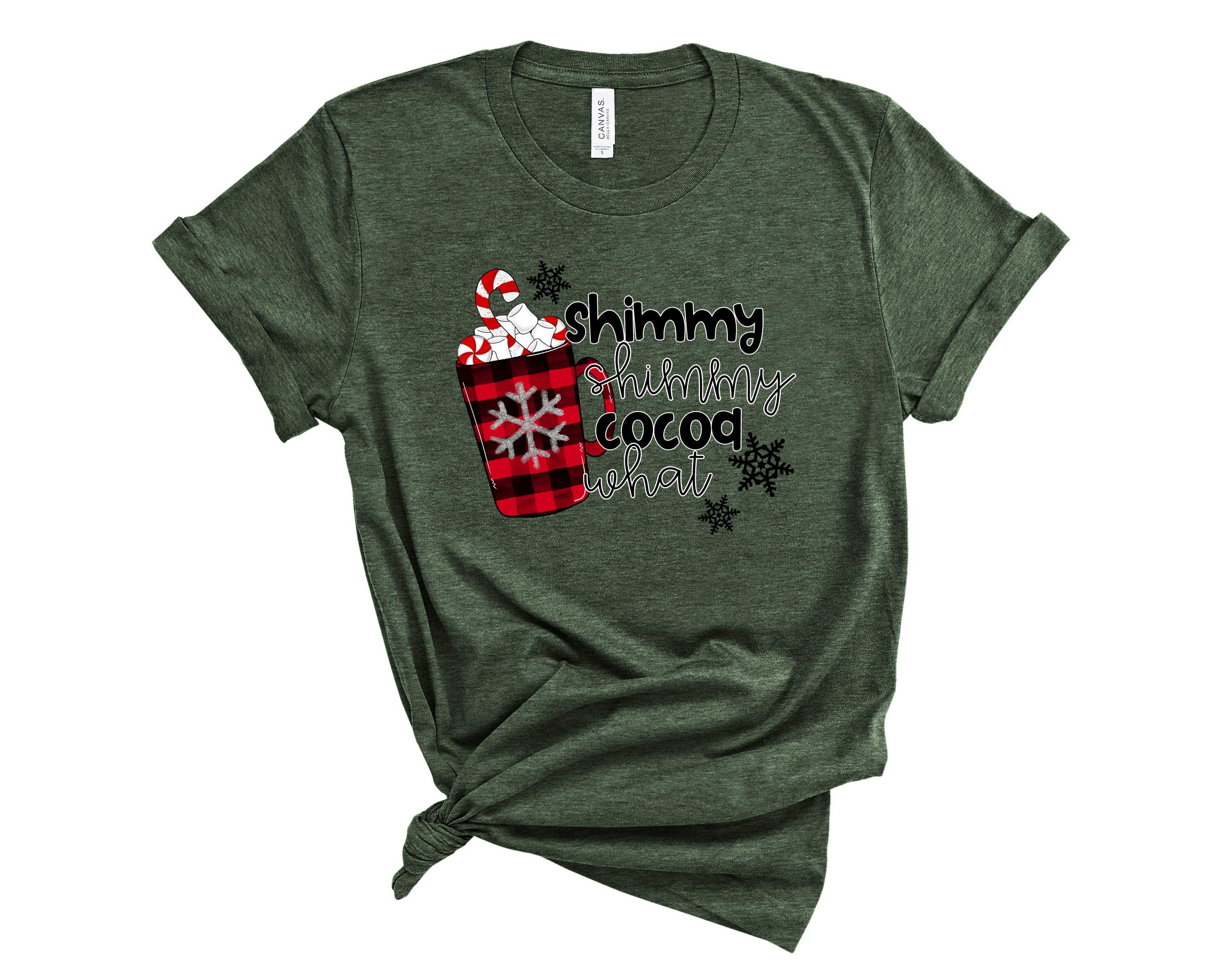 A stylish unisex graphic tee featuring the phrase 'Shimmy Shimmy Cocoa What' in a trendy design.