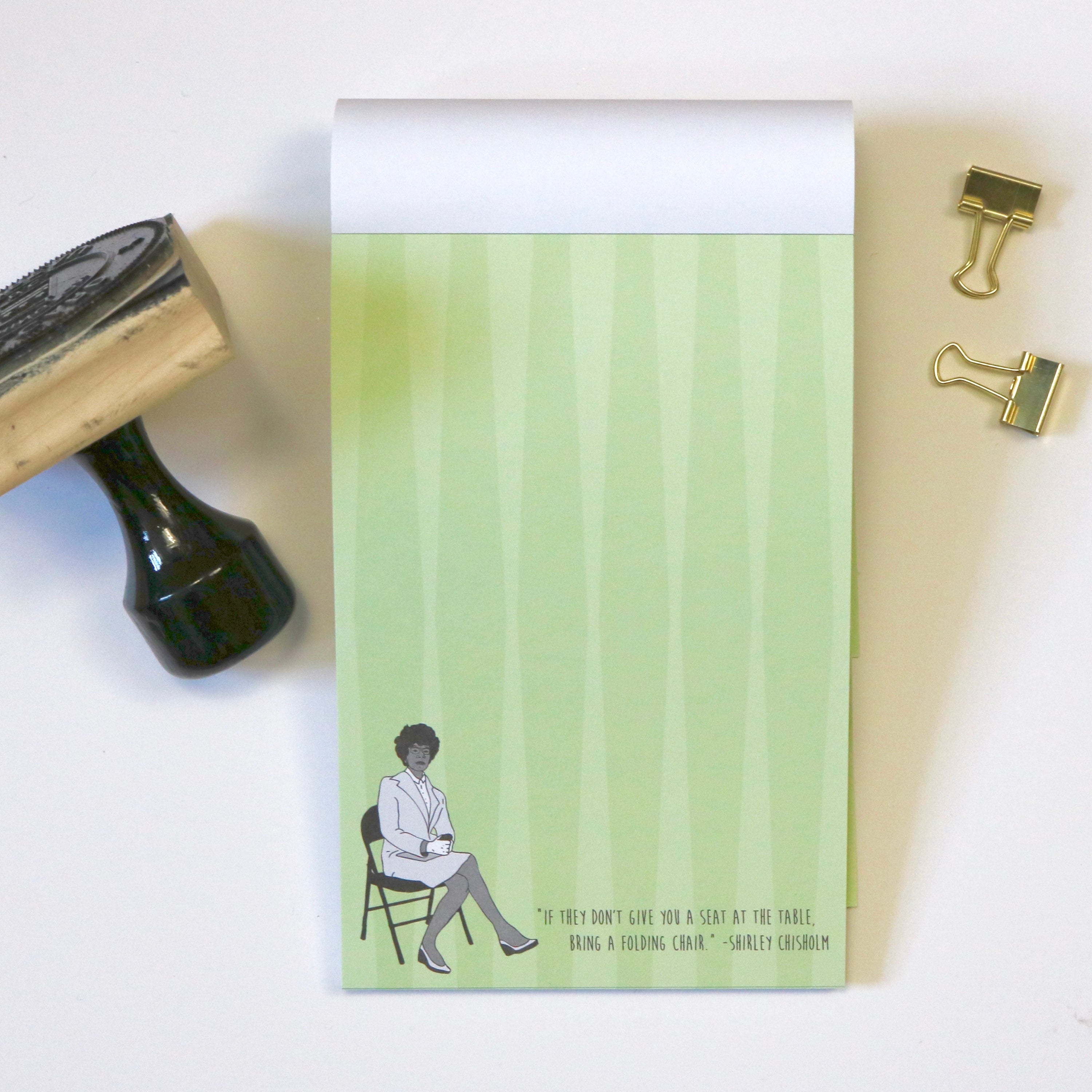 Shirley Chisholm Notepad featuring a green cover and an inspiring quote.