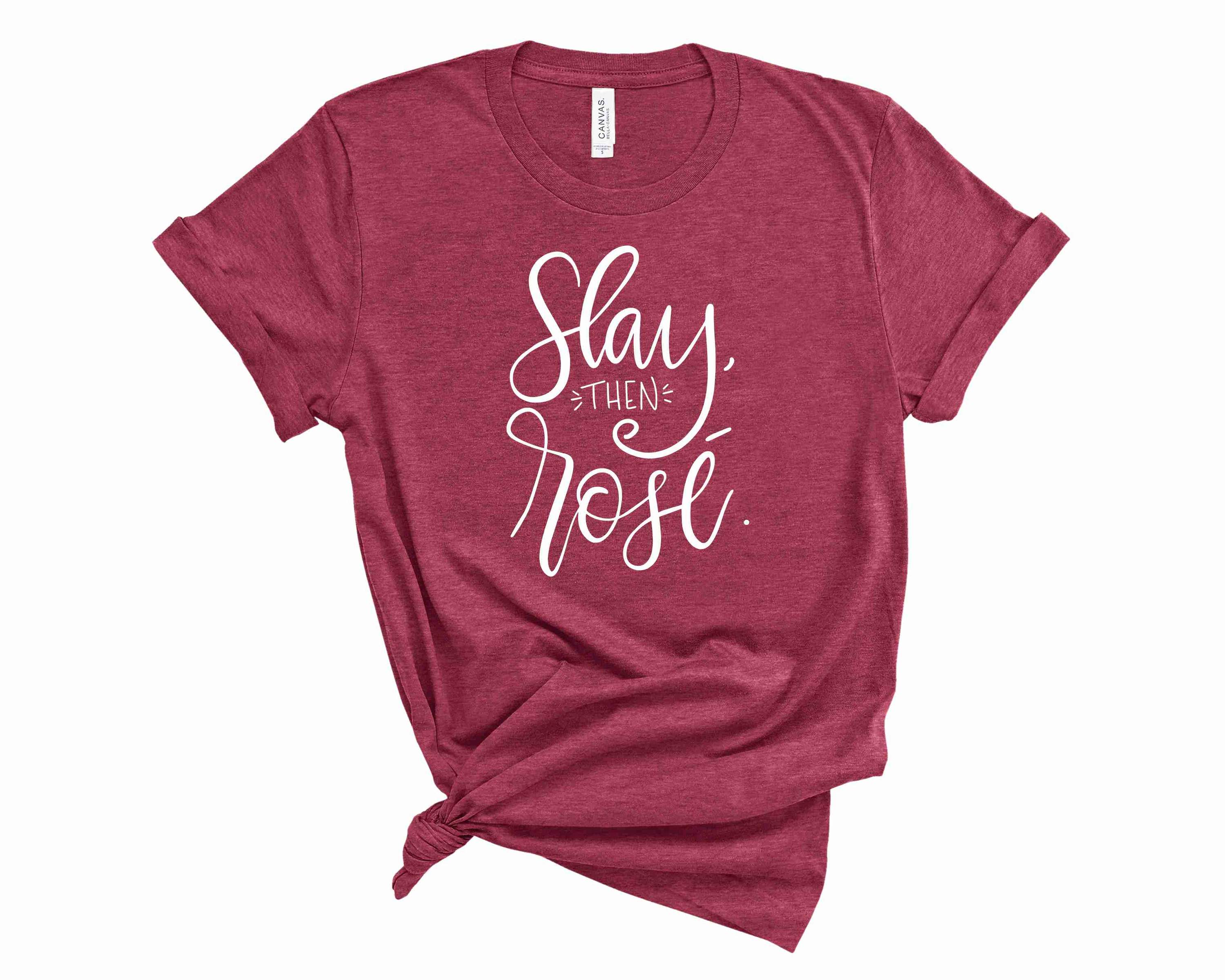 A stylish unisex graphic tee featuring the phrase 'Slay Then Rose' in bold lettering, perfect for casual wear.
