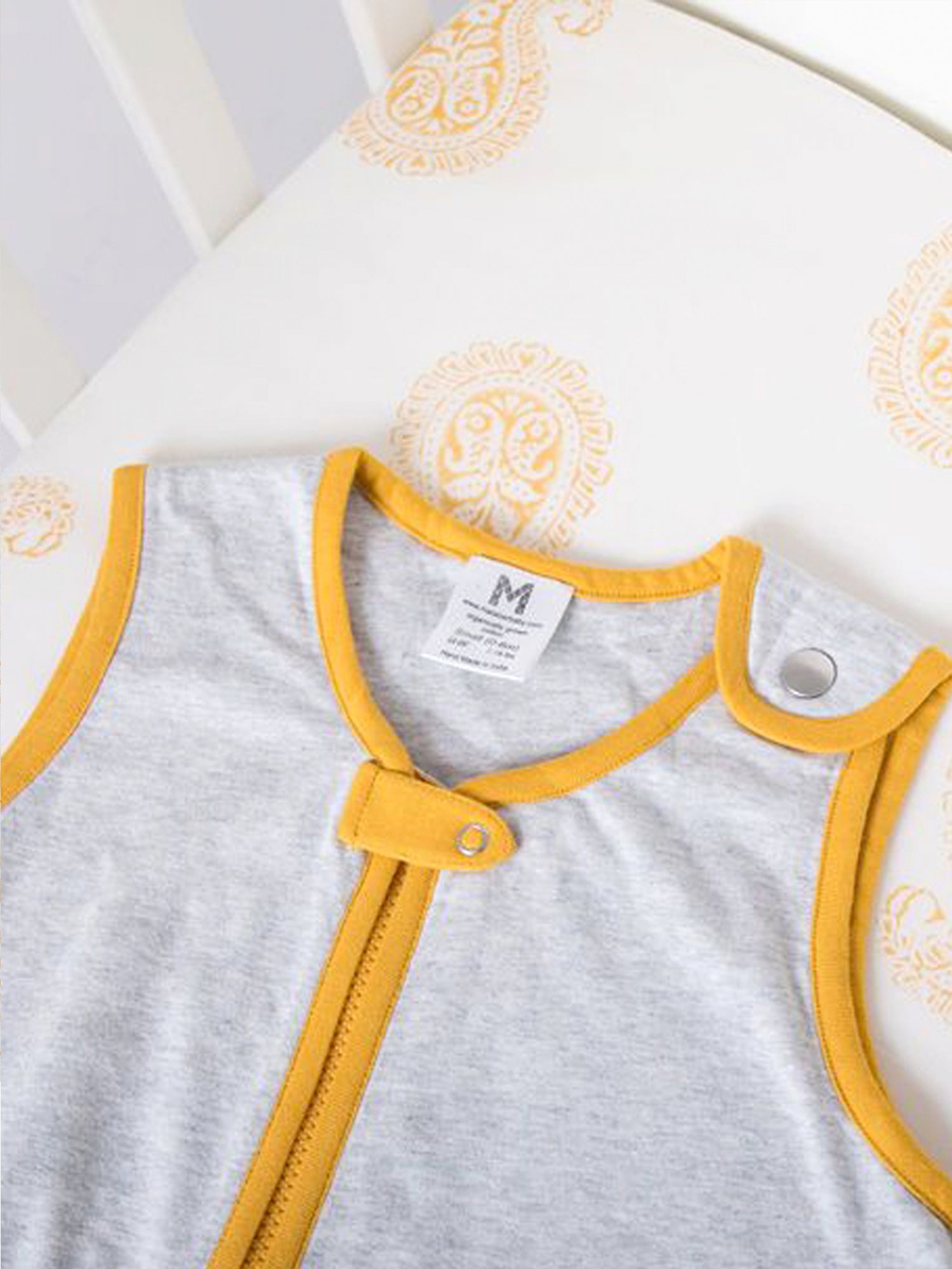 Sleep Sack Baby Gift Set featuring a quilted newborn sleep sack and a block-printed fitted crib sheet, both made from organic cotton.