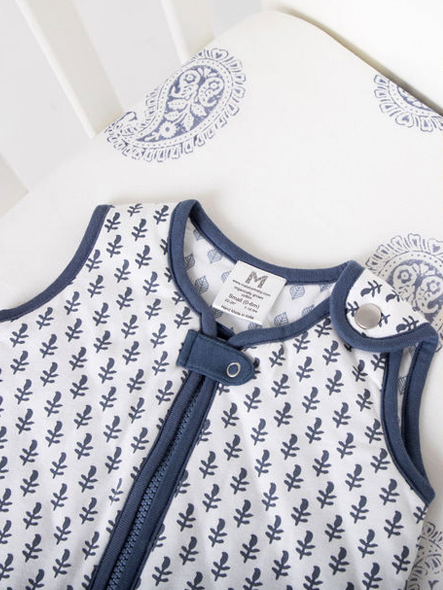 Sleep Sack Baby Gift Set featuring a quilted newborn sleep sack and a block-printed fitted crib sheet, both made from organic cotton.