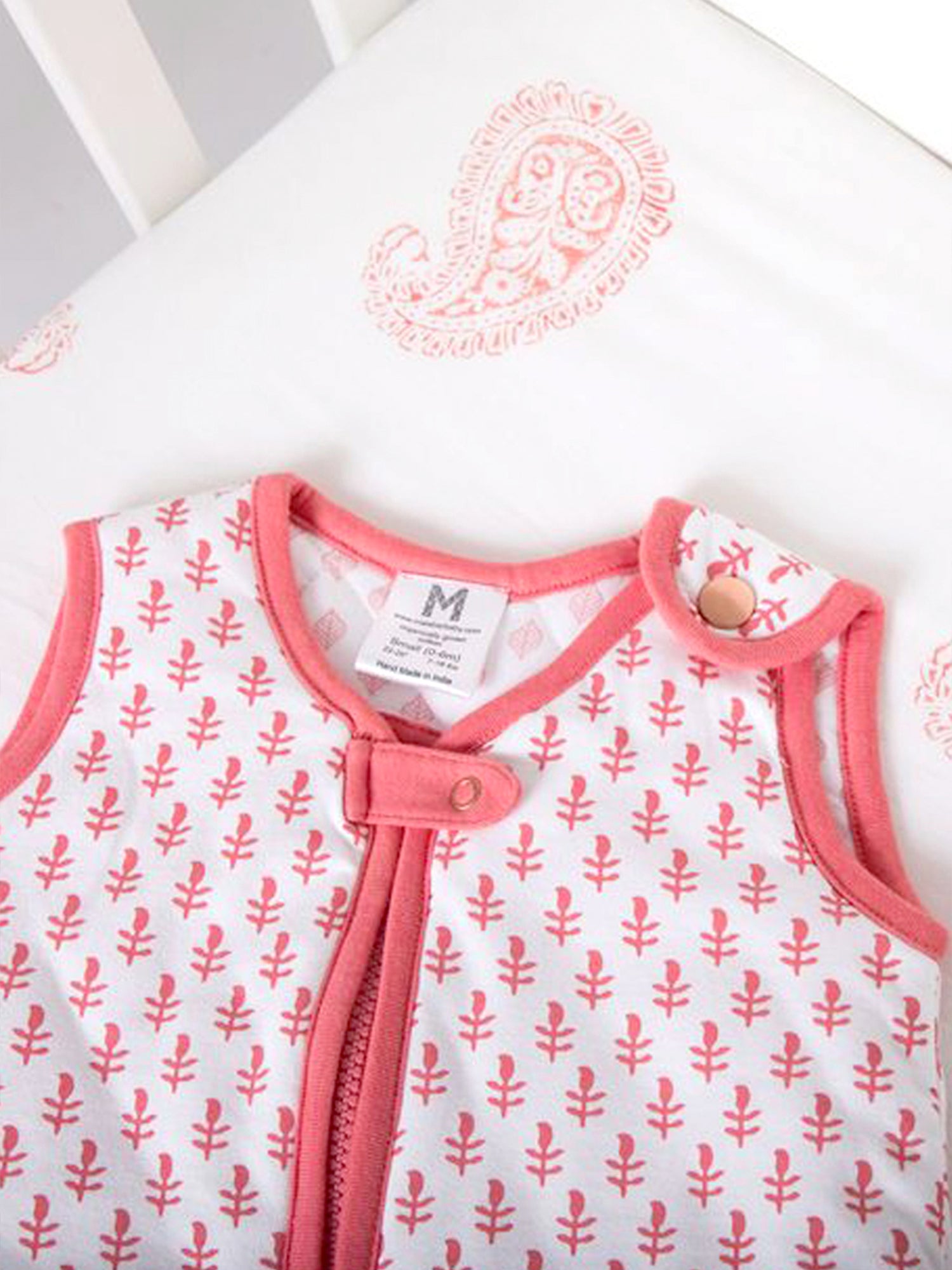 Sleep Sack Baby Gift Set featuring a quilted newborn sleep sack and a block-printed fitted crib sheet, both made from organic cotton.