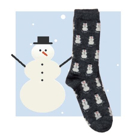 A pair of cozy Snowman Alpaca Socks featuring a playful snowman pattern on a graphite grey background, made from a soft blend of baby alpaca and bamboo.