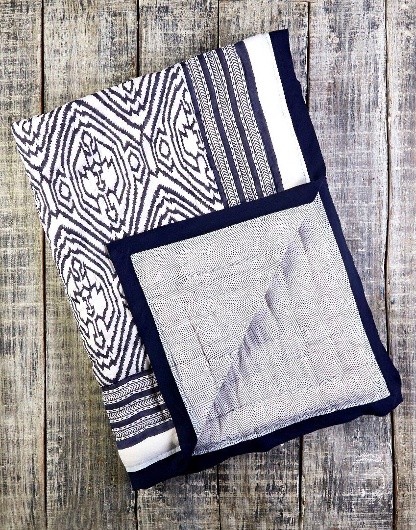 Southside Blue Cotton Quilt featuring unique hand quilted design and reversible pattern, made from hypoallergenic cotton.