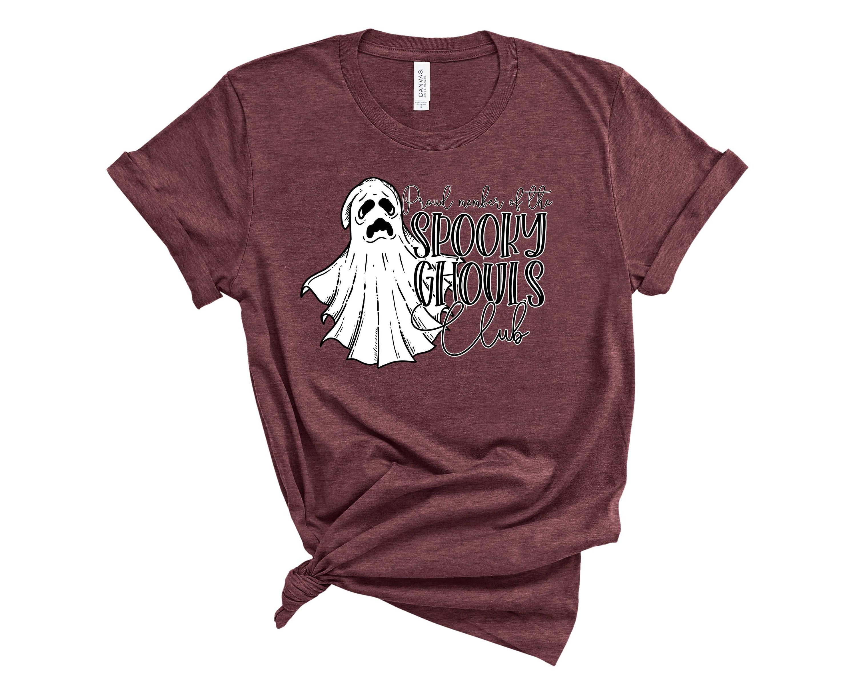 A unisex graphic tee featuring spooky ghouls design, perfect for Halloween enthusiasts.
