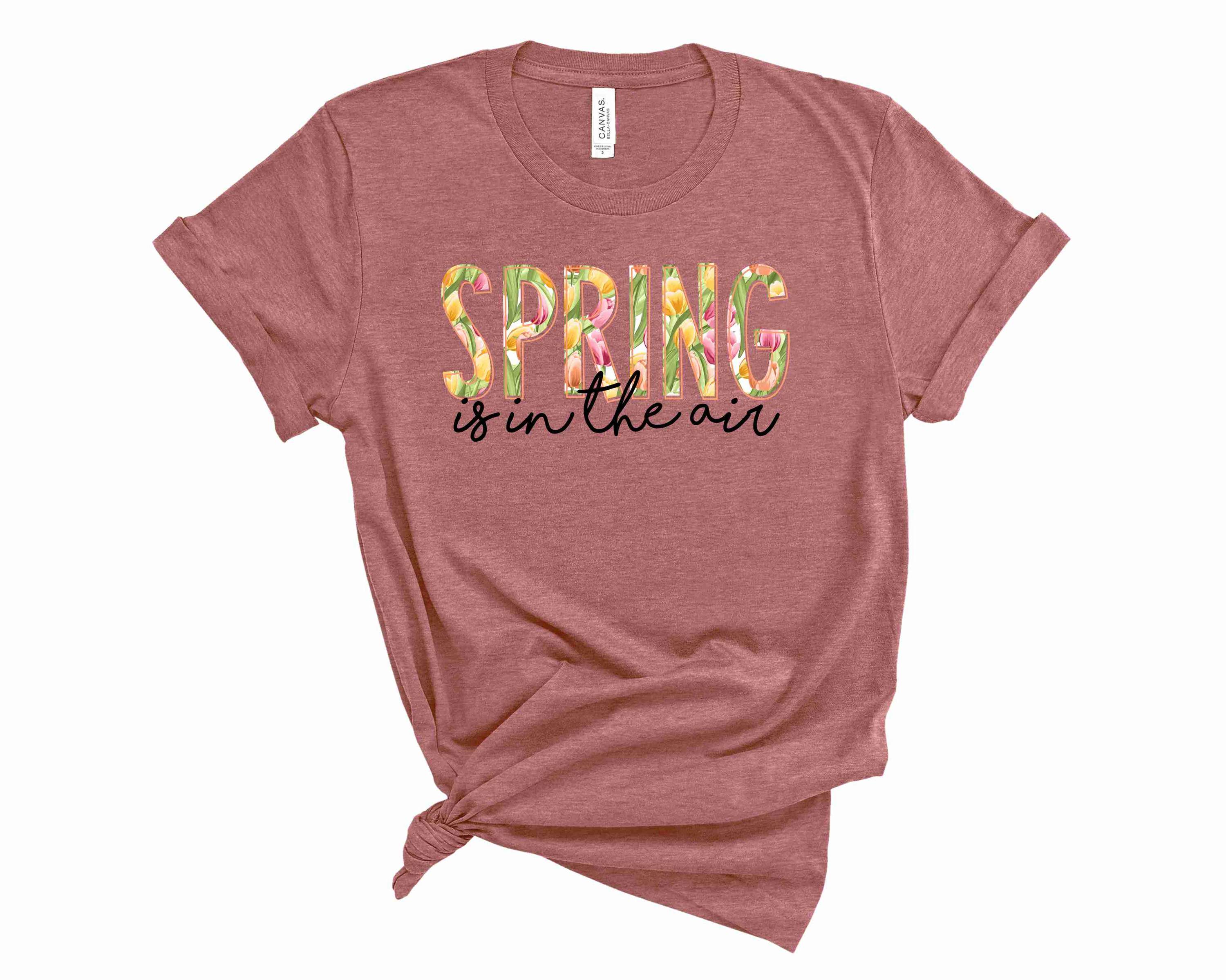 A vibrant unisex graphic tee featuring a spring-themed design, perfect for casual wear.