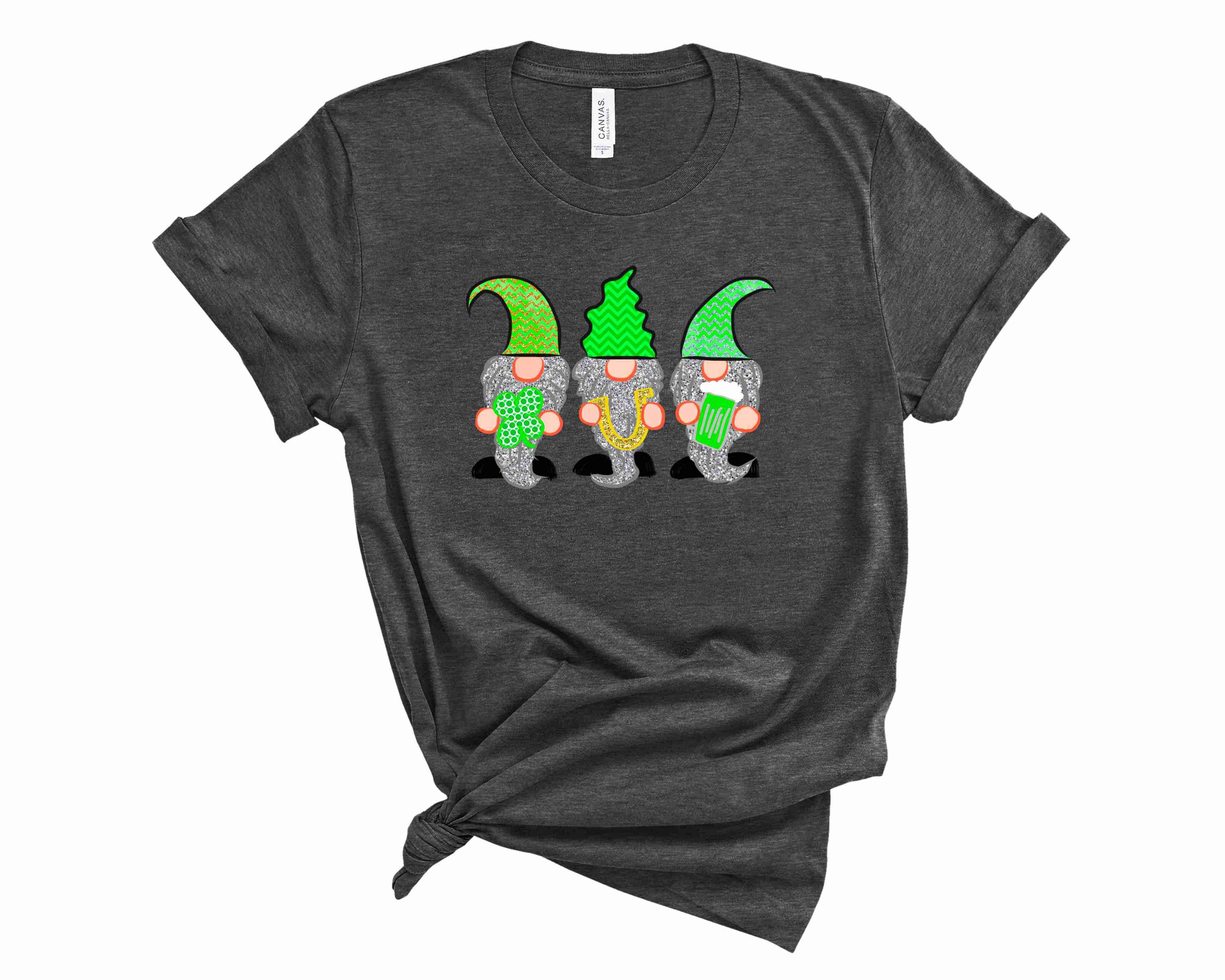 A vibrant unisex graphic tee featuring playful gnomes celebrating St. Patrick's Day, perfect for festive occasions.