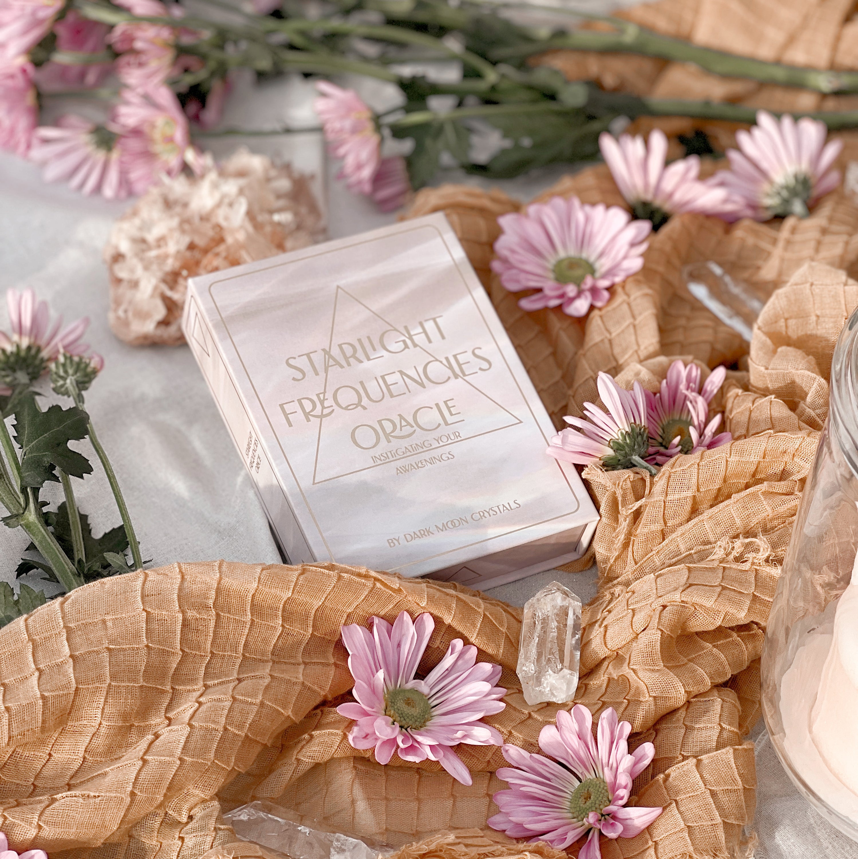 Starlight Frequencies Oracle Deck featuring 44 cards with gold foil accents and a velvet texture, displayed in a magnetic flip box.