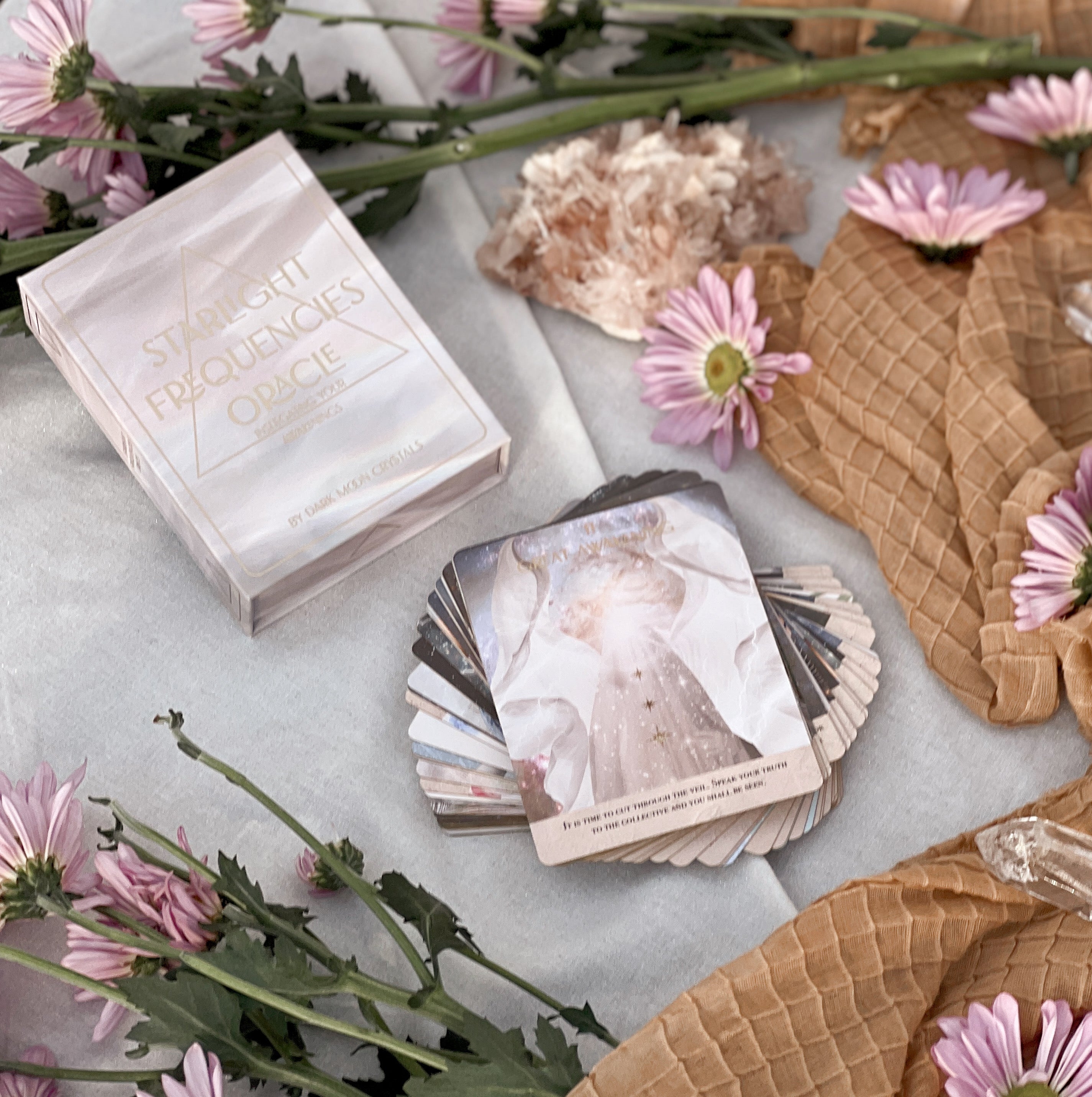 Starlight Frequencies Oracle Deck featuring 44 cards with gold foil accents and a velvet texture, displayed in a magnetic flip box.