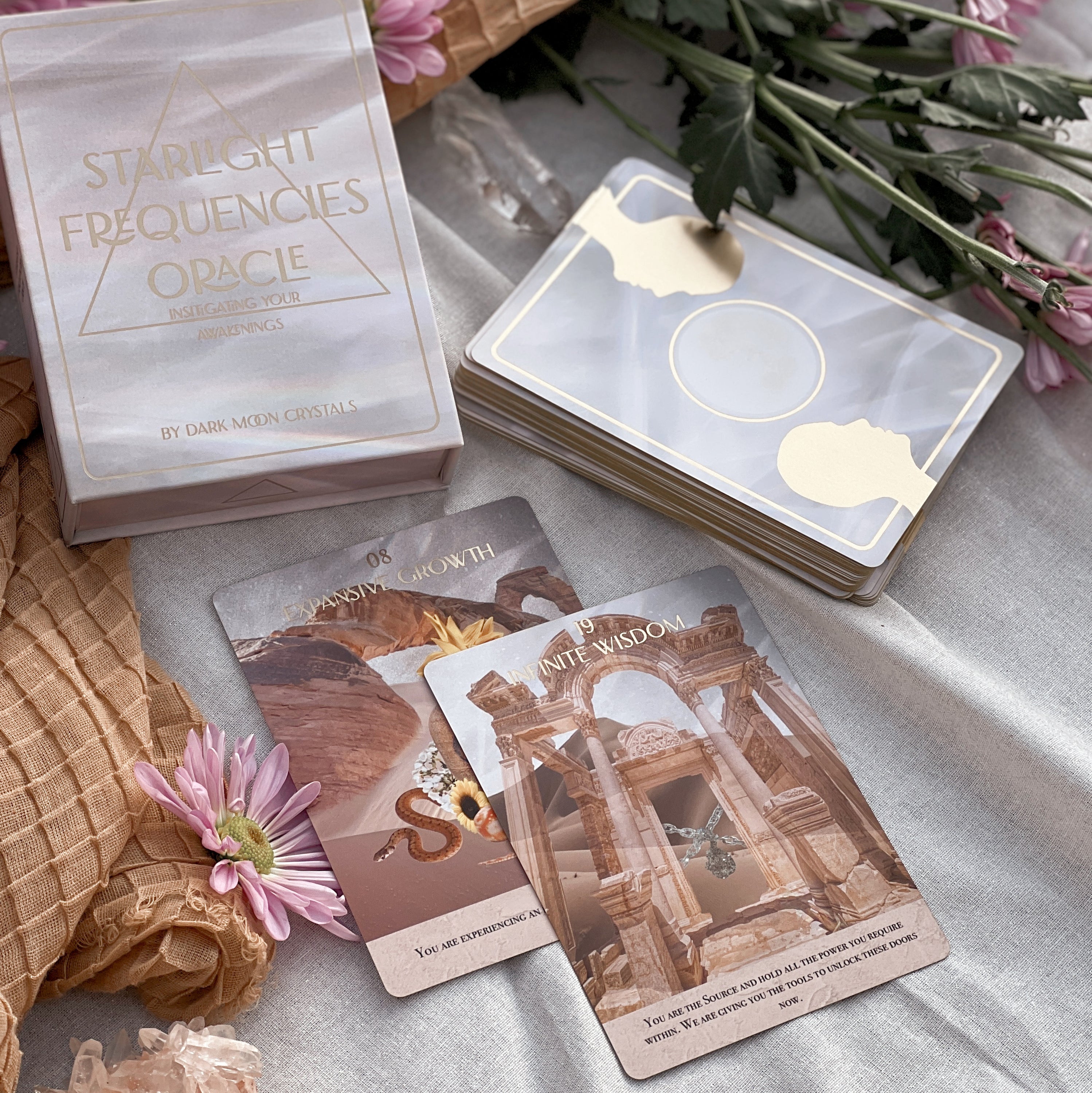 Starlight Frequencies Oracle Deck featuring 44 cards with gold foil accents and a velvet texture, displayed in a magnetic flip box.