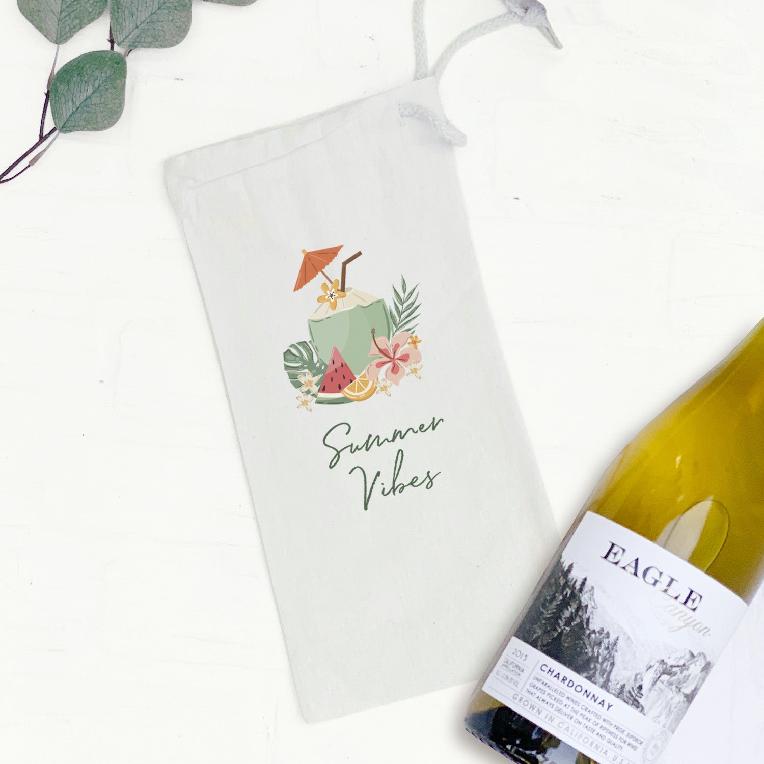 A stylish canvas wine bag featuring a coconut design, perfect for summer outings, holding a 750mL bottle securely.