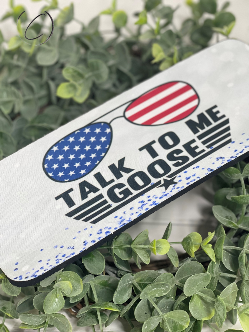 Talk To Me Goose Slap Wrap Can Cooler in vibrant colors, designed to fit 12oz cans and bottles, made from durable neoprene material.