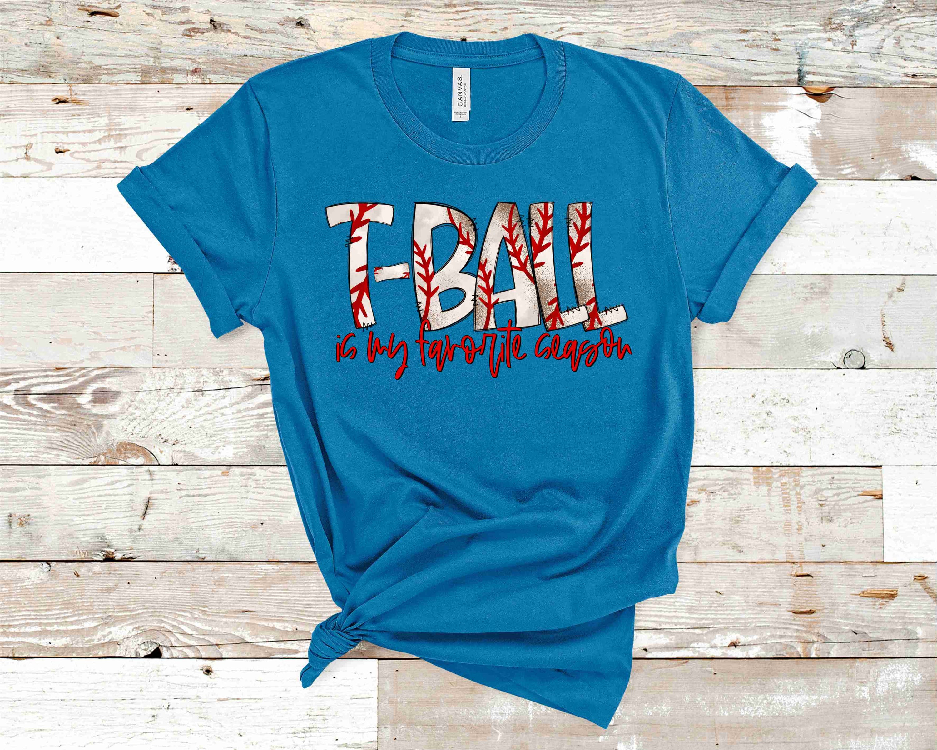 Unisex graphic tee featuring 'T-Ball Is My Favorite Season' design, perfect for casual wear.
