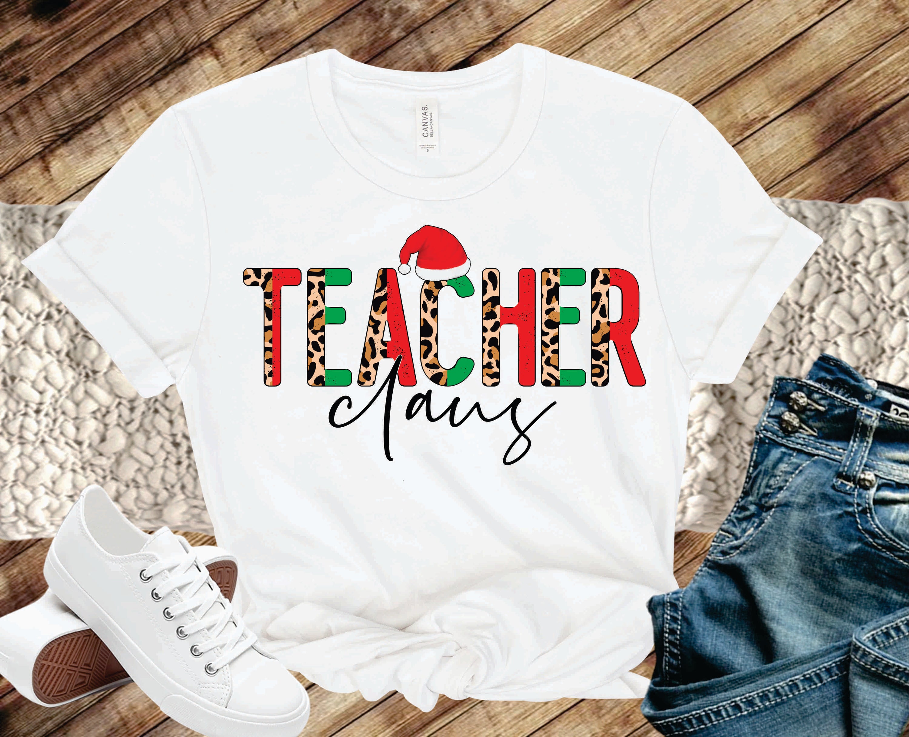 Teacher Claus Half Leopard Graphic Tee featuring a unique half leopard design on a unisex t-shirt, perfect for holiday celebrations.
