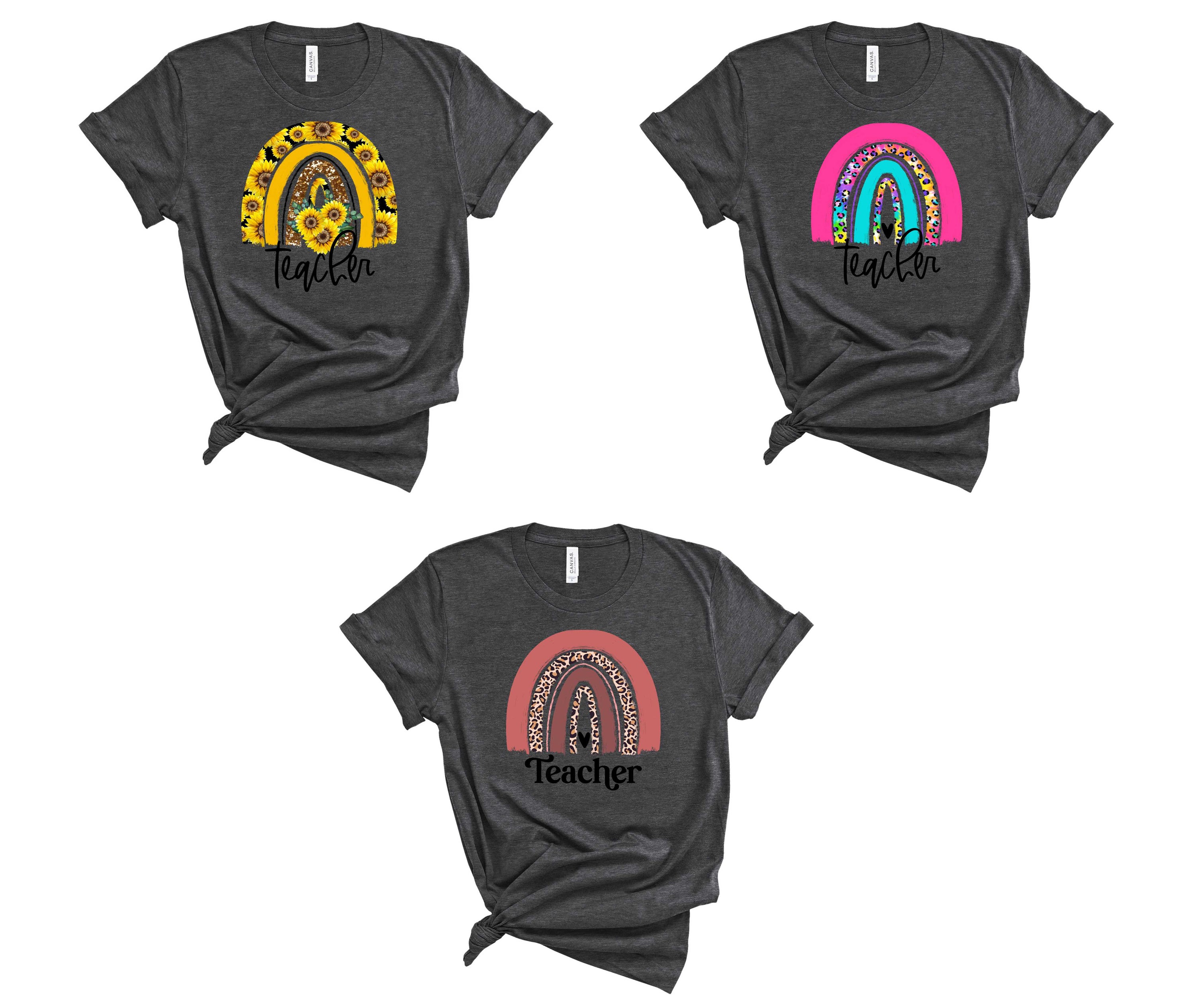 A colorful unisex graphic tee featuring a vibrant rainbow design, perfect for teachers and casual wear.