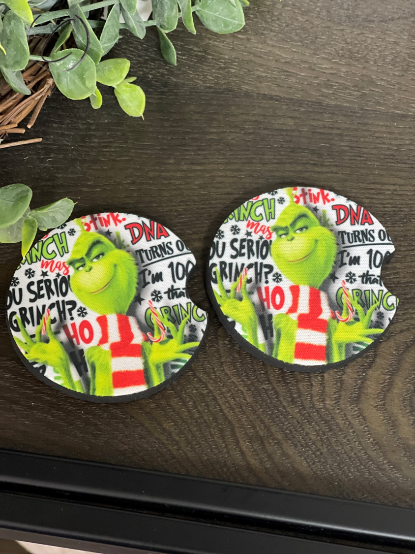 The Grinch Neoprene Car Coaster Set featuring a vibrant design, perfect for car cup holders.