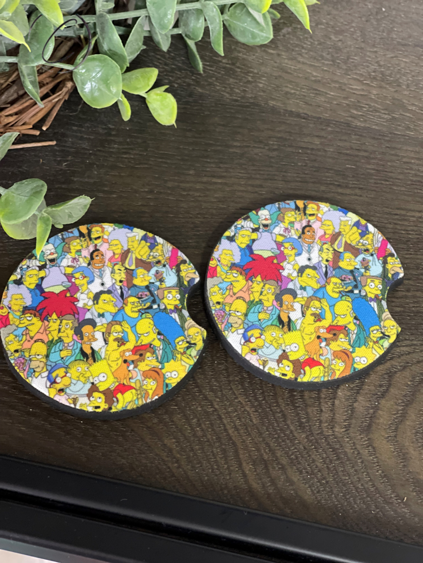 The Simpsons Neoprene Car Coaster Set featuring vibrant character designs, perfect for car cup holders.