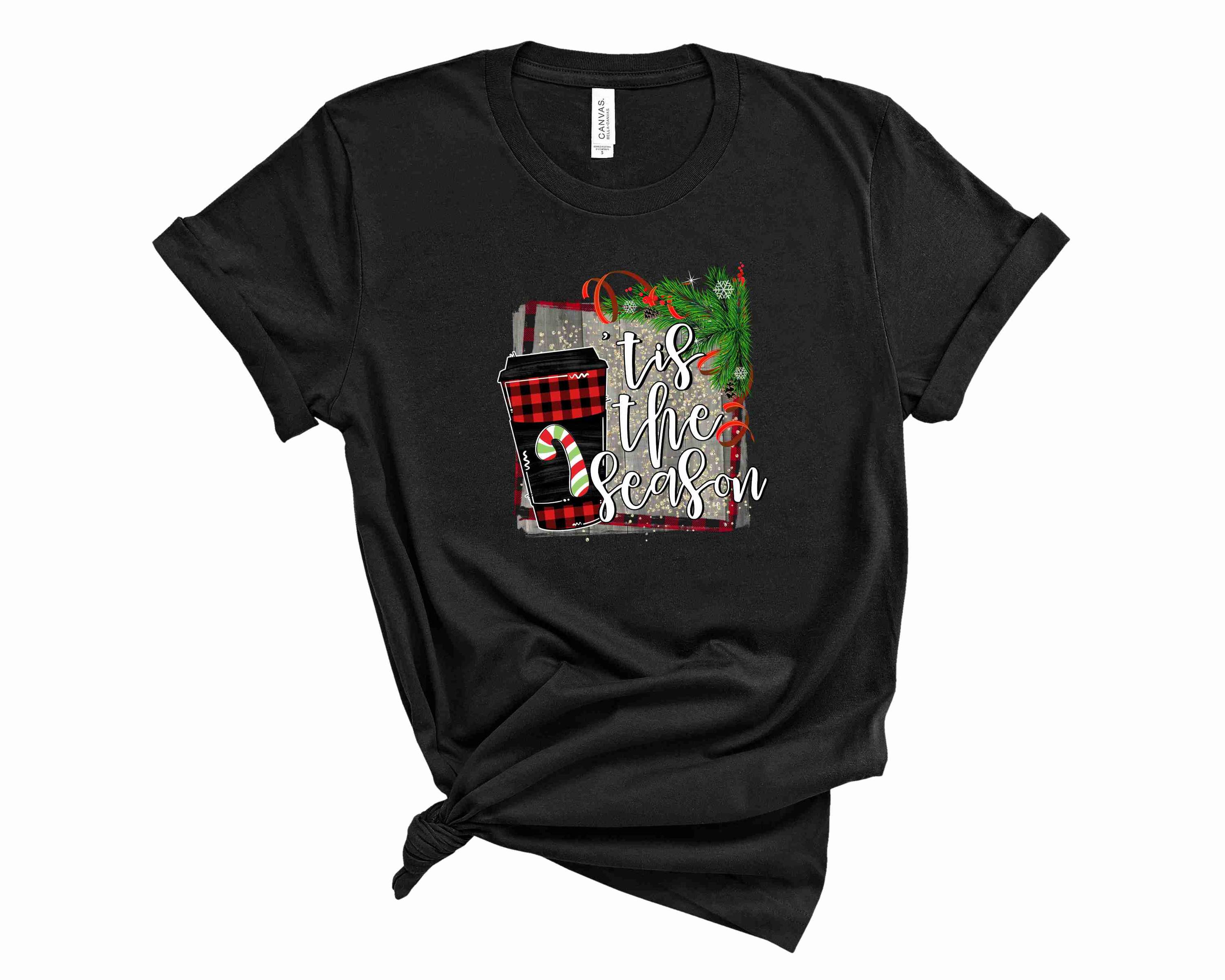 A festive unisex T-shirt featuring a holiday graphic that reads 'Tis the Season', perfect for casual wear during the holiday season.