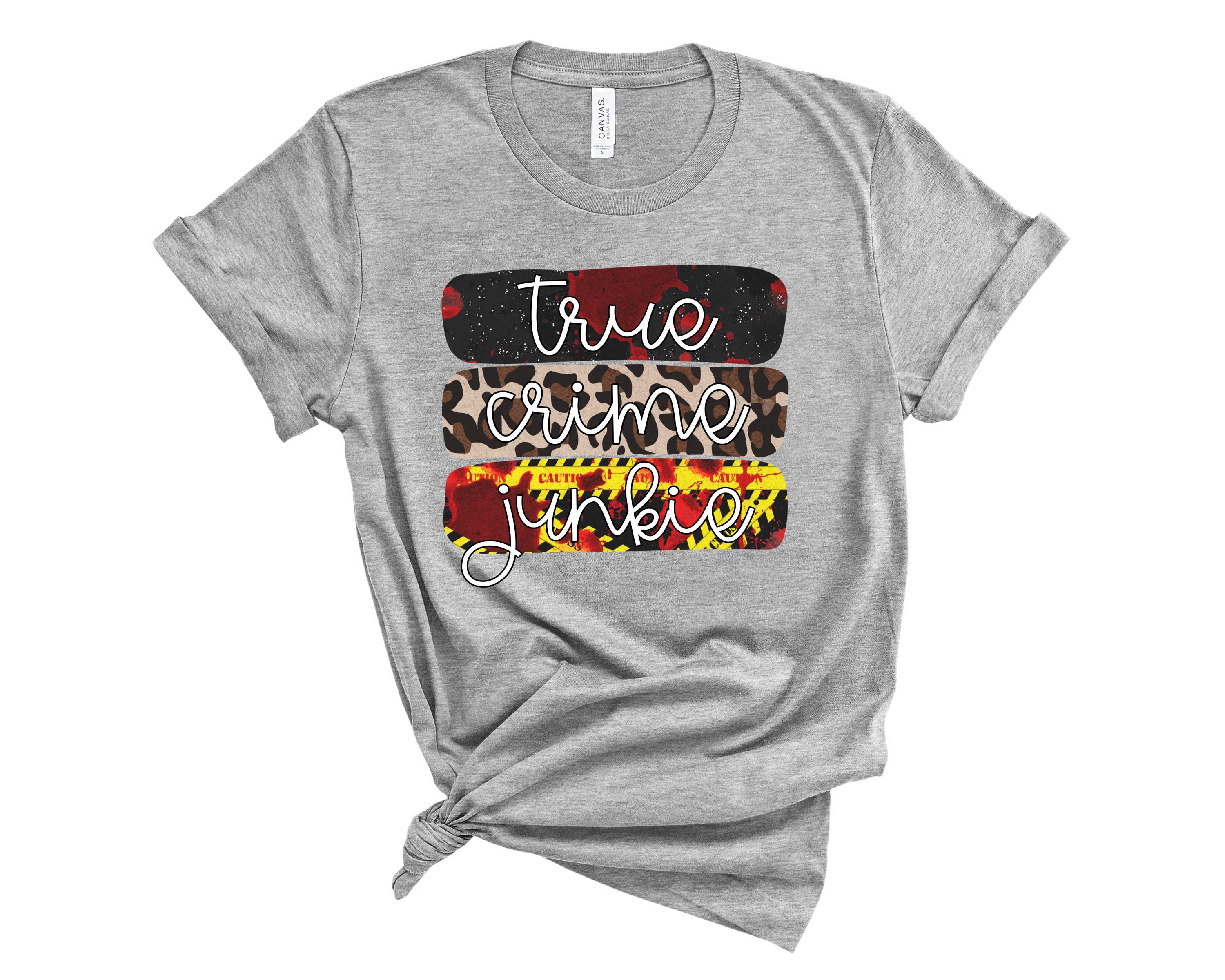 True Crime Junkie Graphic Tee featuring bold print on a unisex t-shirt.