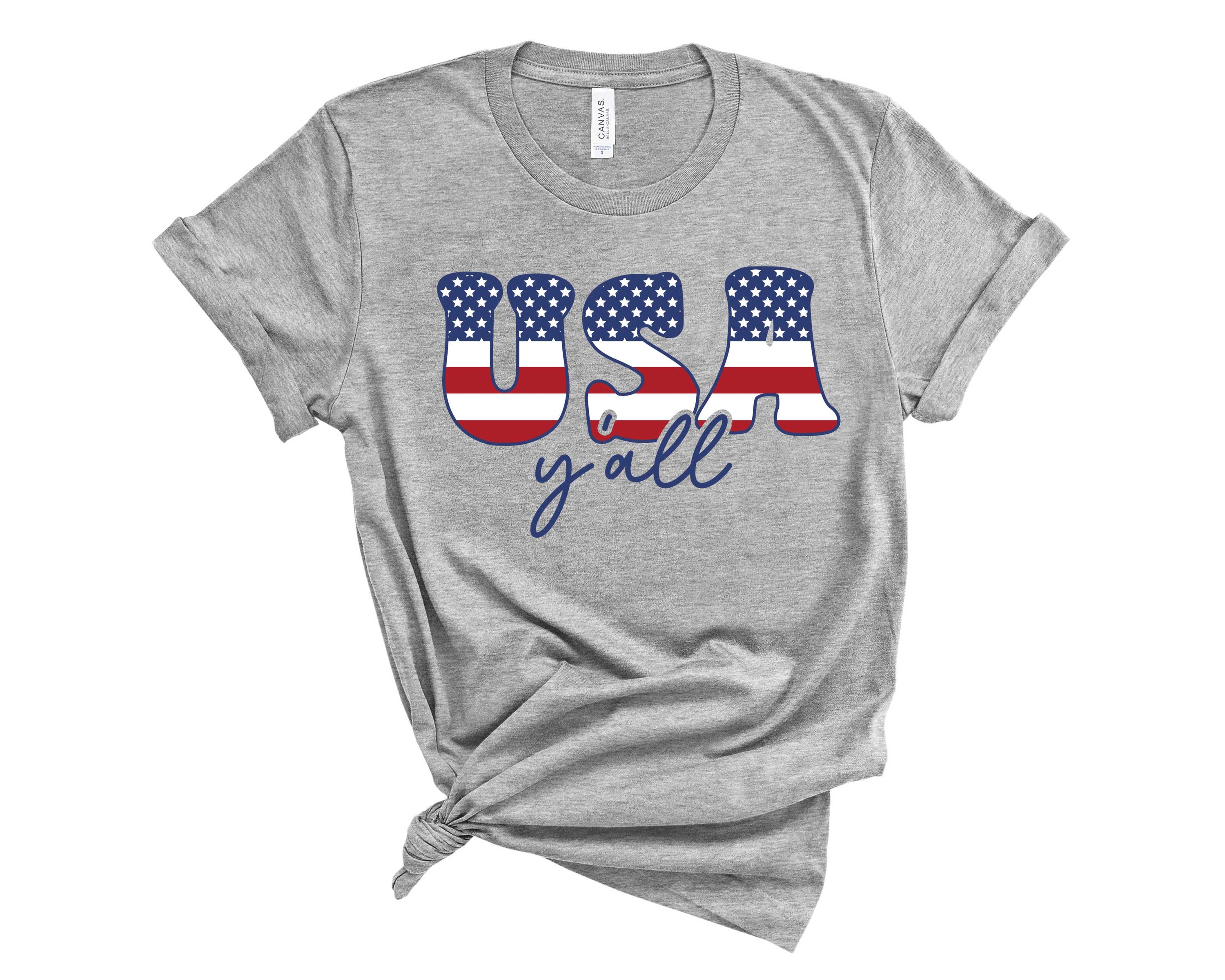 USA Y'all Graphic Tee featuring bold text and vibrant colors on a unisex t-shirt.