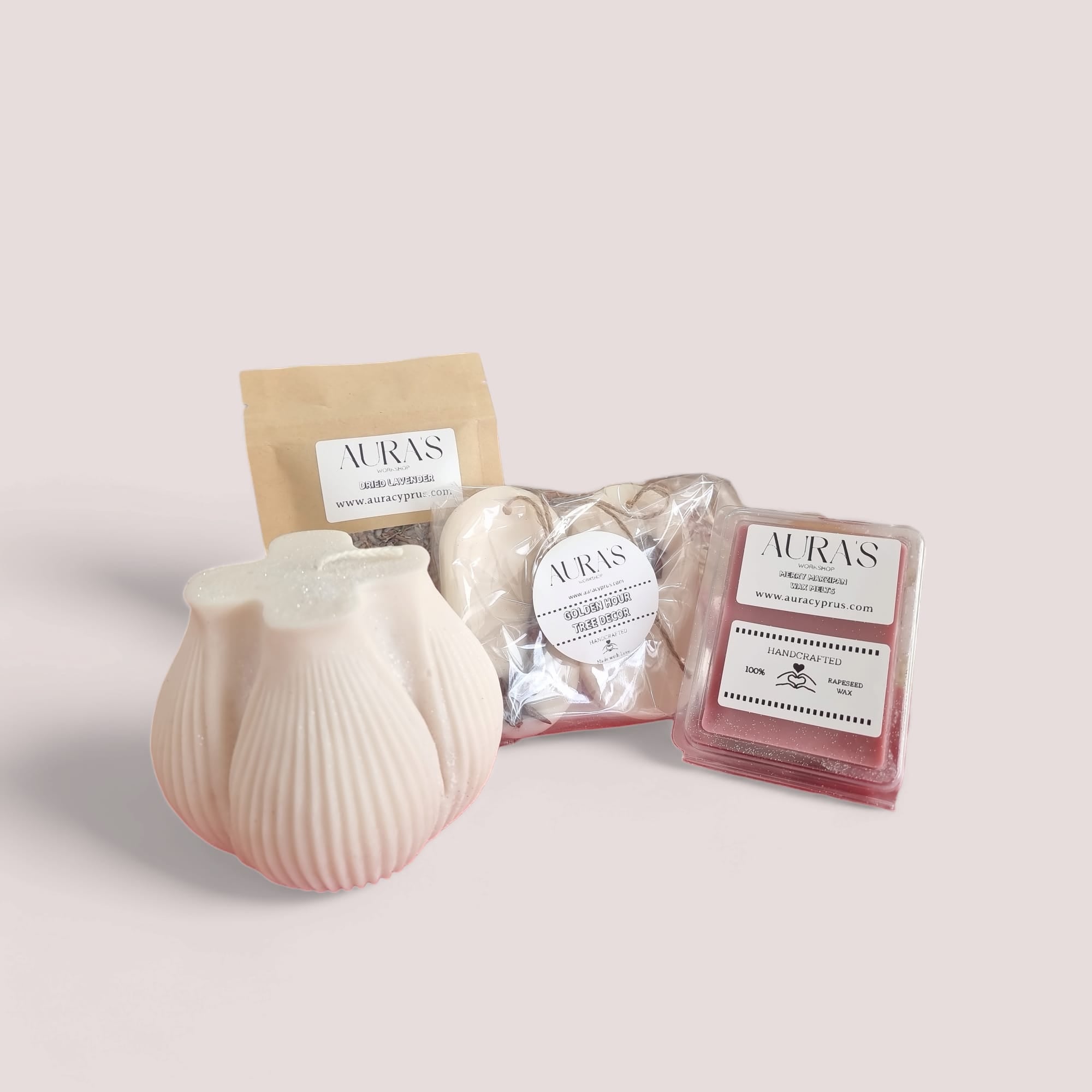 Valentine's Gift Set featuring a large candle, marzipan wax melts, wax wardrobe fragrants, and dried lavender, beautifully arranged.