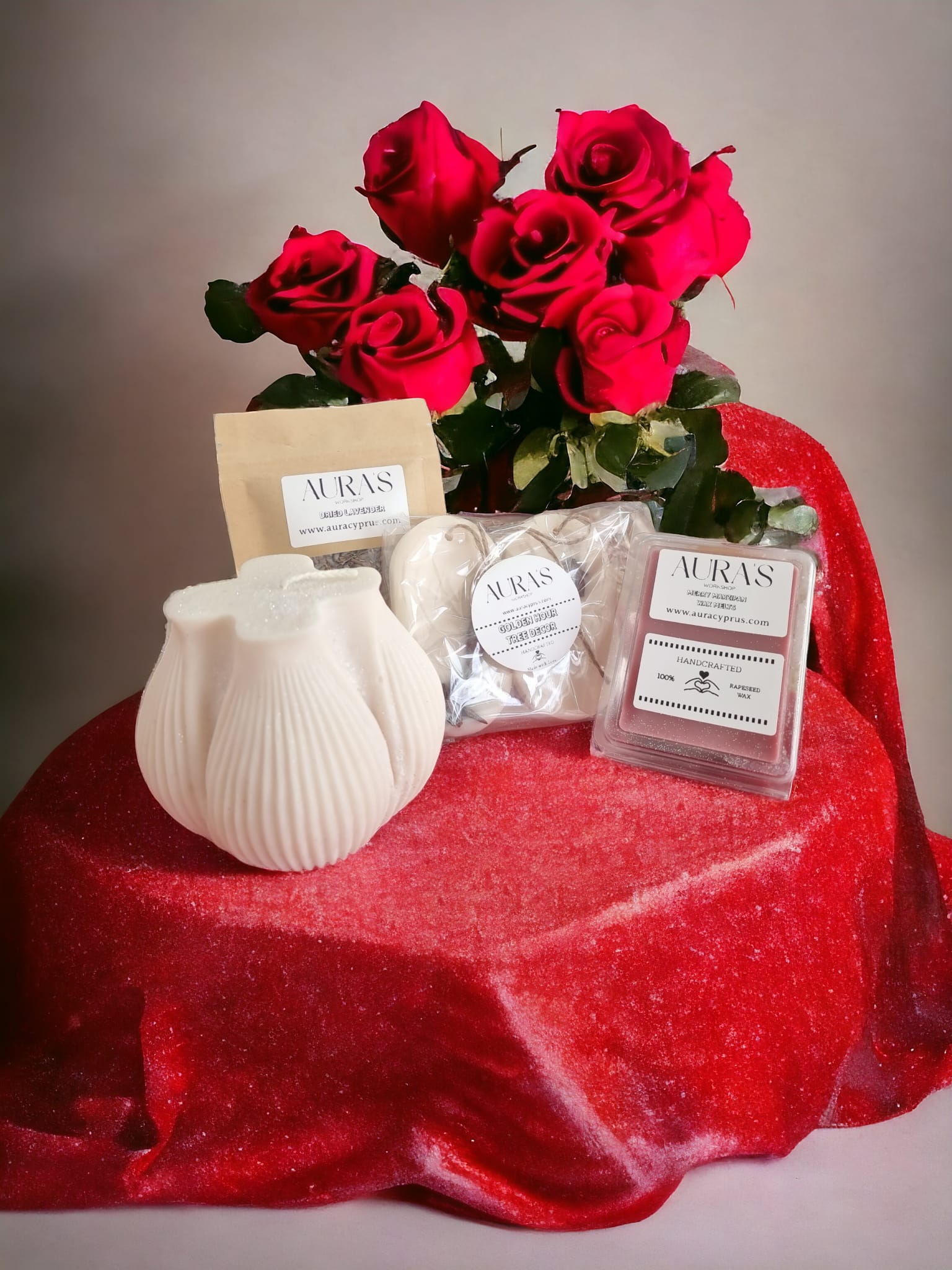 Valentine's Gift Set featuring a large candle, marzipan wax melts, wax wardrobe fragrants, and dried lavender, beautifully arranged.