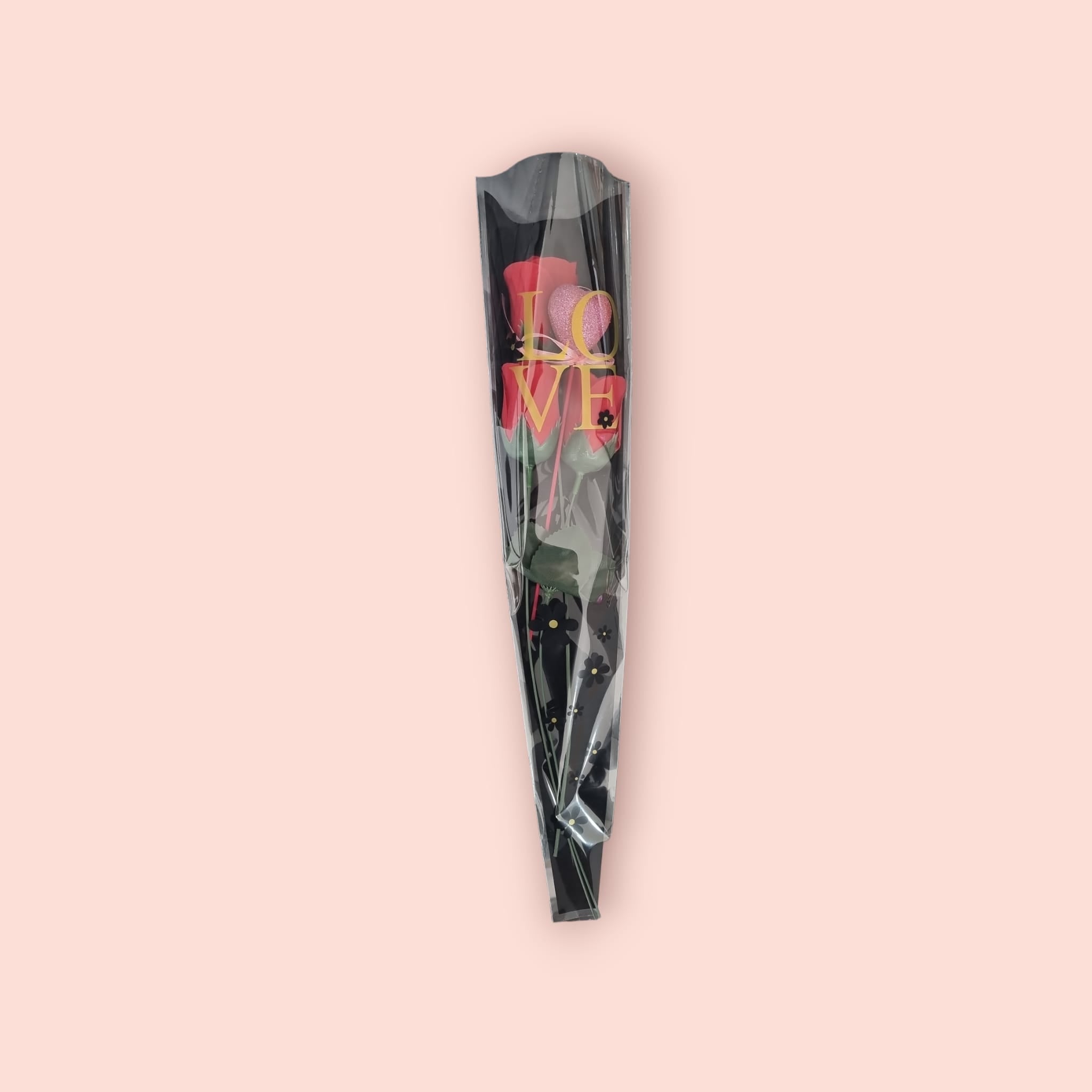 A beautiful arrangement of 3 red artificial roses with a pink glitter heart, elegantly wrapped in black Valentine's themed packaging.